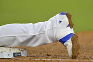 Freddie Freeman puts layers of strappings over his cleats to support his injured ankle (Image Source: IMAGN)