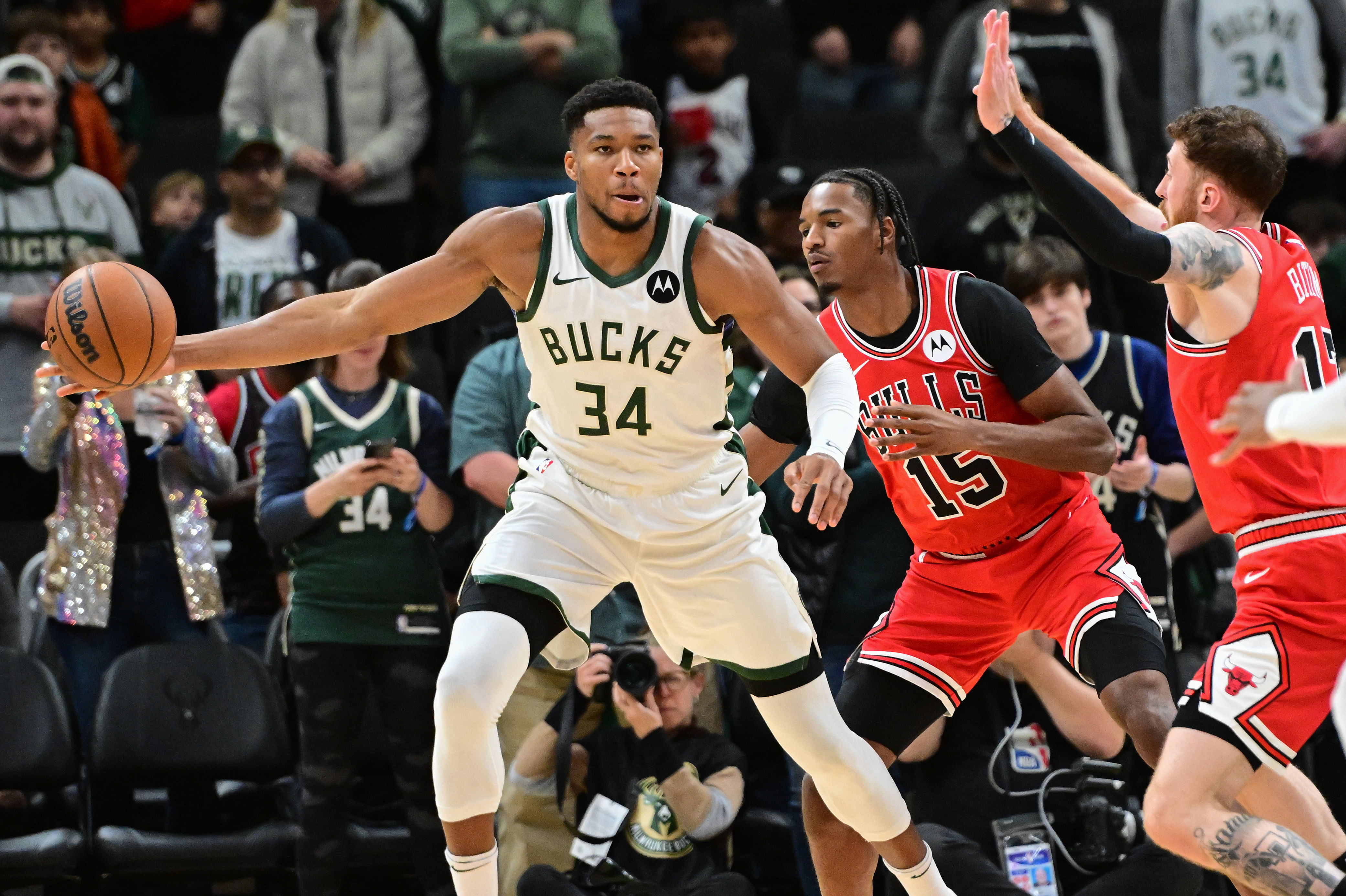 Milwaukee Bucks forward Giannis Antetokounmpo looks to pass ball away against the Chicago Bulls at Fiserv Forum. Photo Credit: Imagn