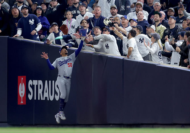 "Yankees fans being pathetic losers? Shocking" - Fans furious after NY supporter interferes with Mookie Betts in World Series Game 4