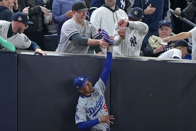 WATCH: 2 Yankees fans escorted out after trying to grab ball from Mookie Betts during Game 4 of World Series