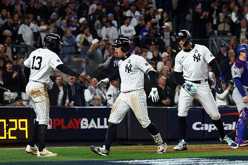 Anthony Volpe celebrates with his teammates after hitting his grand slam in Game 4 (Photo Credit: IMAGN)