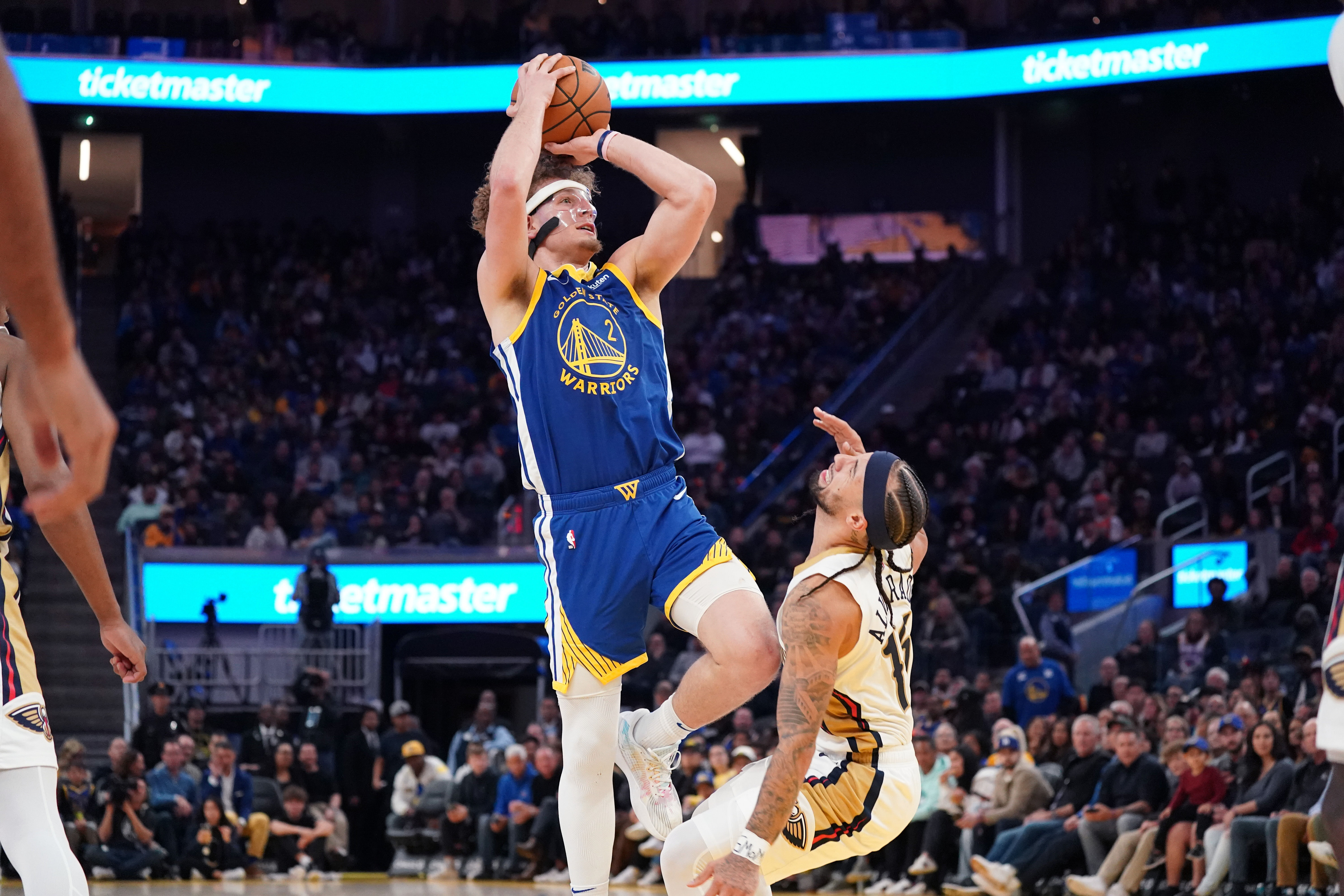 Golden State Warriors guard Brandin Podziemski drives against New Orleans Pelicans guard Jose Alvarado at Chase Center. Mandatory Credit: Imagn