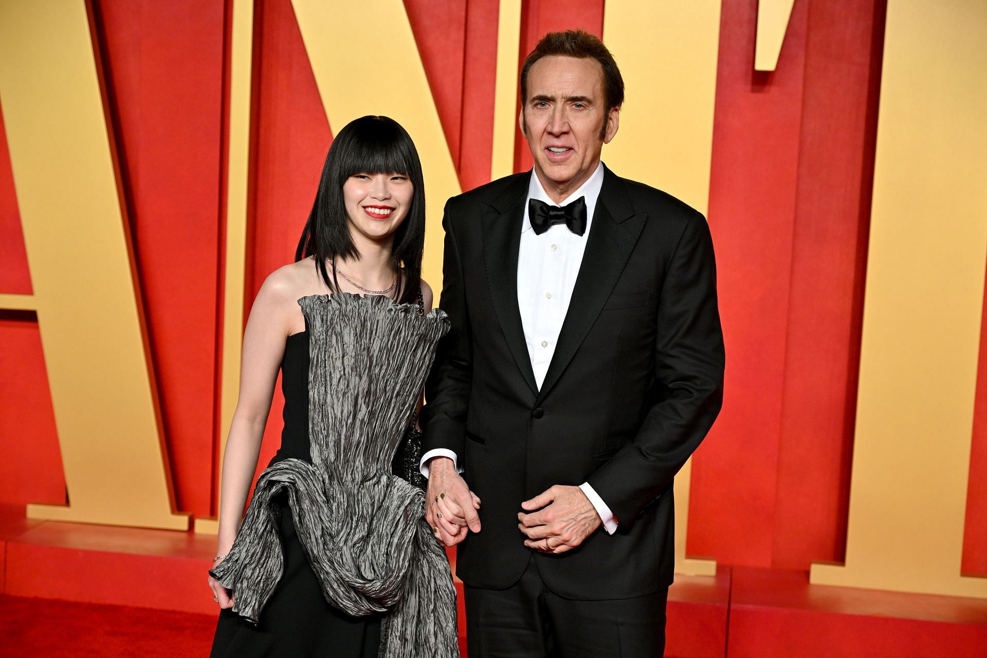 Nicolas Cage seen with wife Riko Shibata at the 2024 Vanity Fair Oscar Party (Image via Getty)