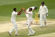 Ravichandran Ashwin (left) celebrating after picking up a wicket in the Boxing Day Test.