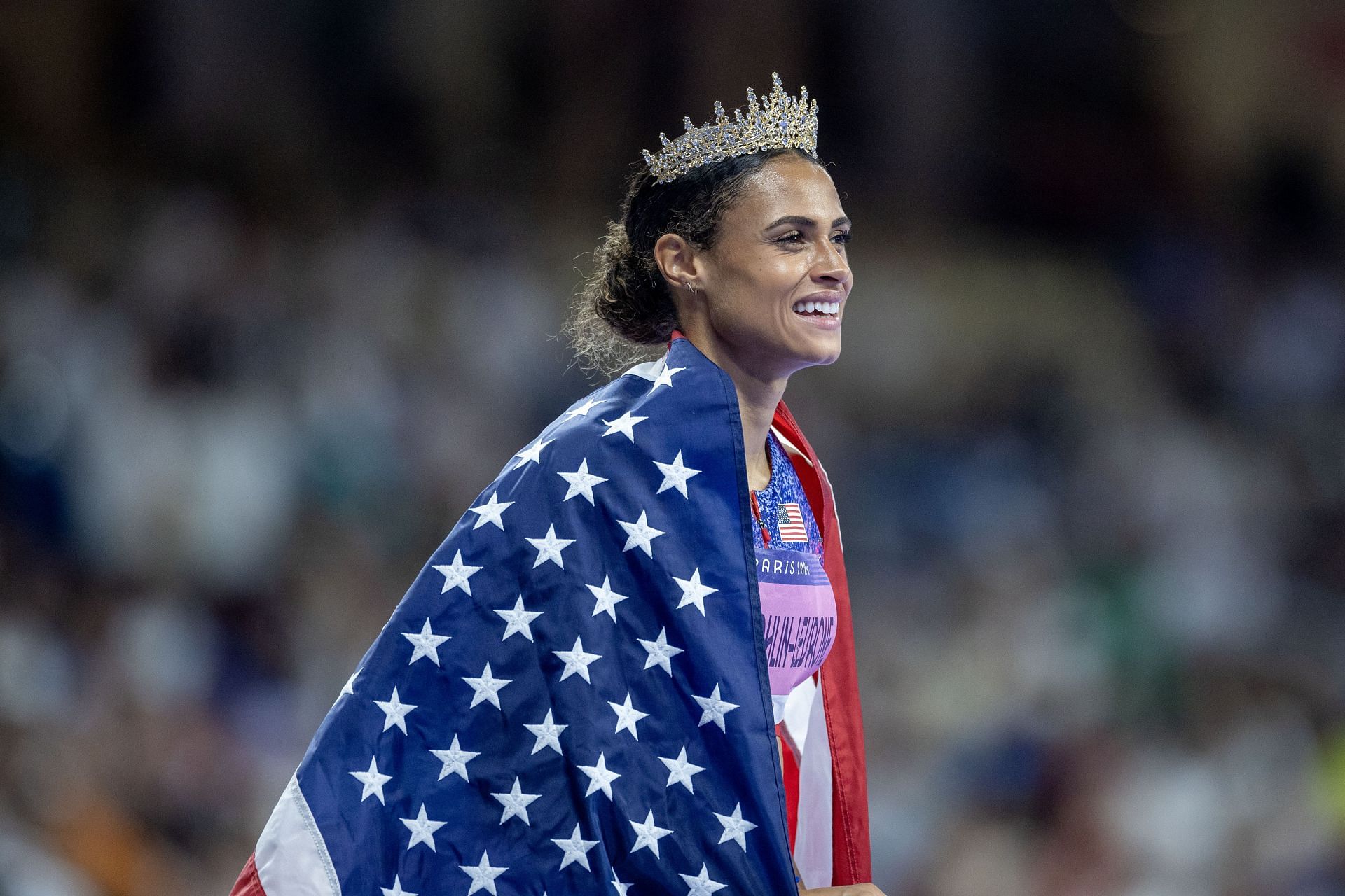 Sydney McLaughlin-Levrone of the United States wearing a crown after breaking the world record in her gold medal win in the Women&#039;s 400m Hurdle Final during the 2024 Summer Olympic Games in Paris, France. (Photo via Getty Images)