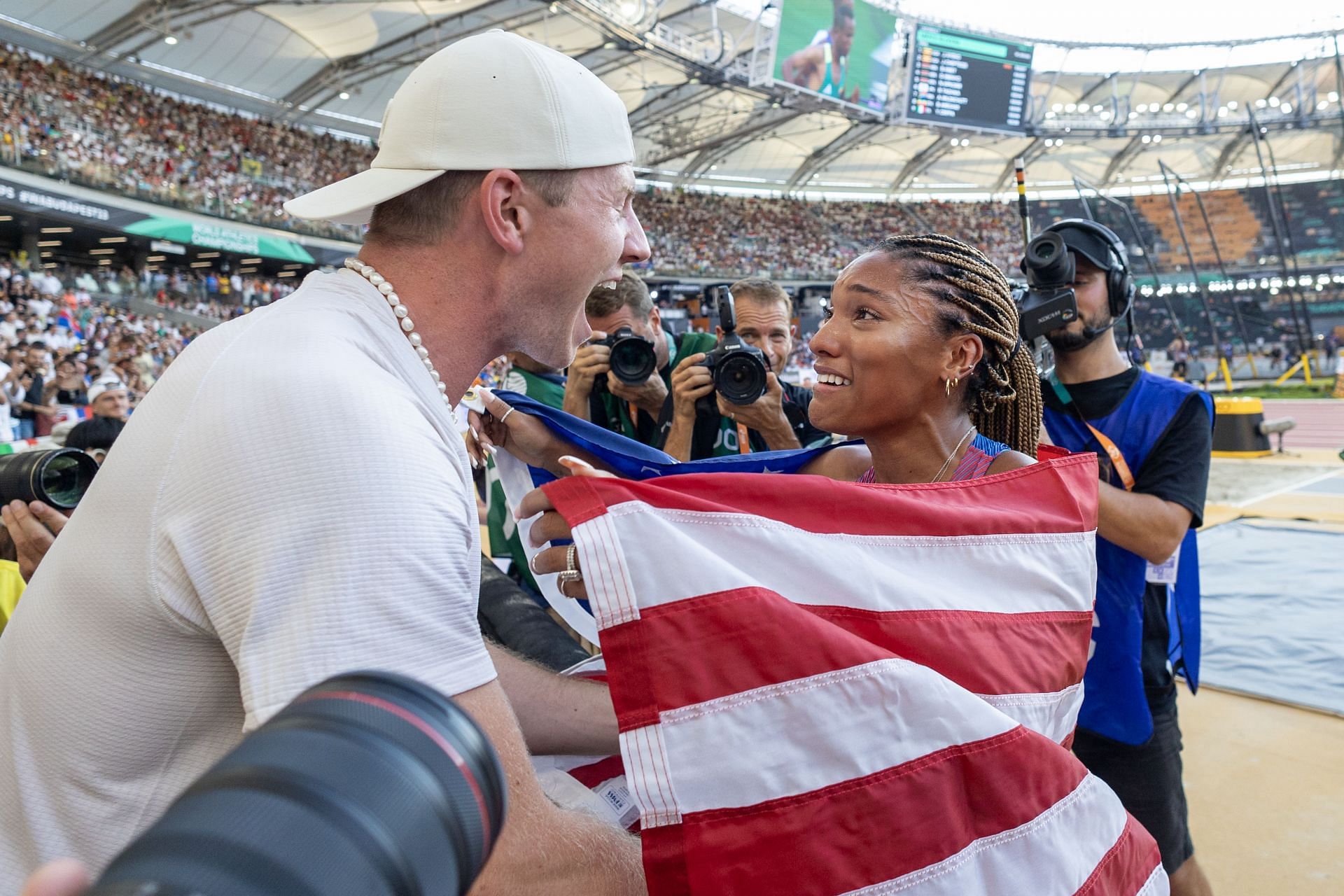 Tara Davis-Woodhall of the United States celebrates her silver medal win with her husband Hunter Woodhall after the Women&#039;s Long Jump Final during the World Athletics Championships in Budapest, Hungary. (Photo via Getty Images)