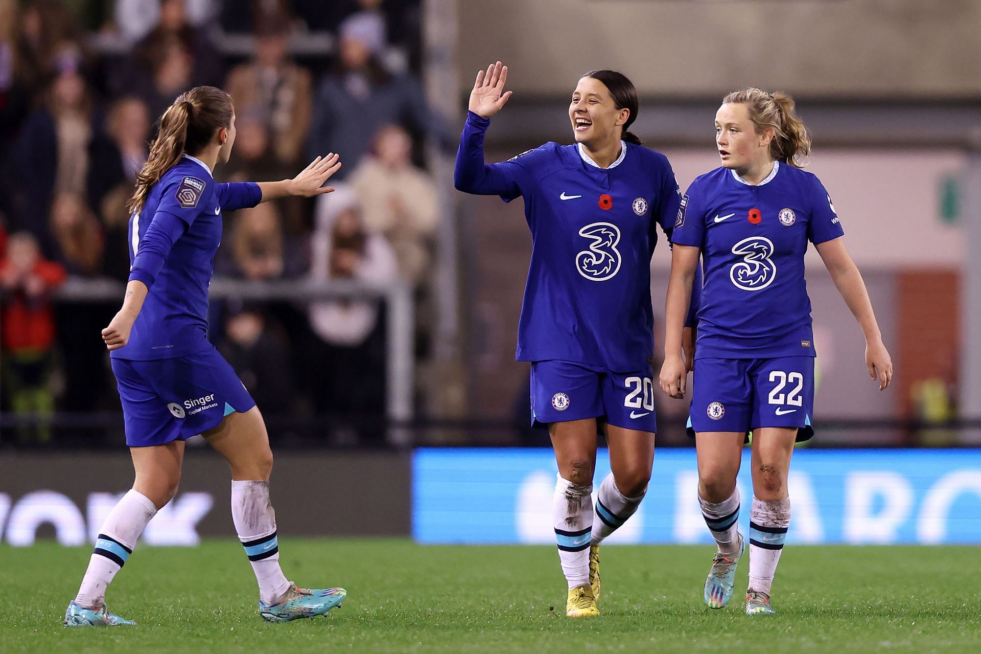 LEIGH, ENGLAND - NOVEMBER 06: Sam Kerr of Chelsea celebrates with Erin Cuthbert and Guro Reiten after scoring their team