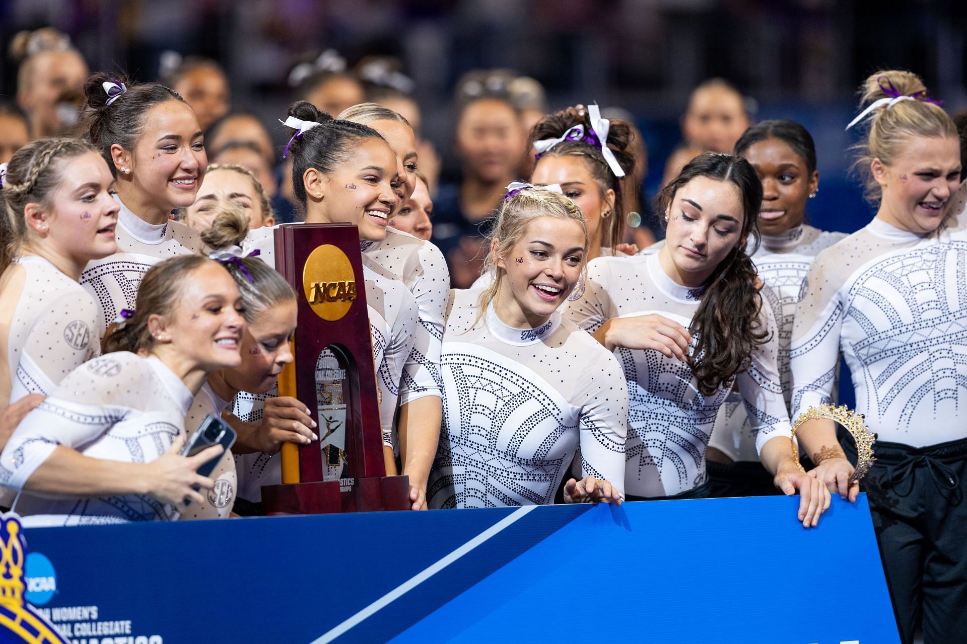 Louisiana State University receive their National Championship trophy after the 2024 NCAA Division I Women&#039;s Gymnastics Championships. (Photo by Aric Becker/ISI Photos/Getty Images)