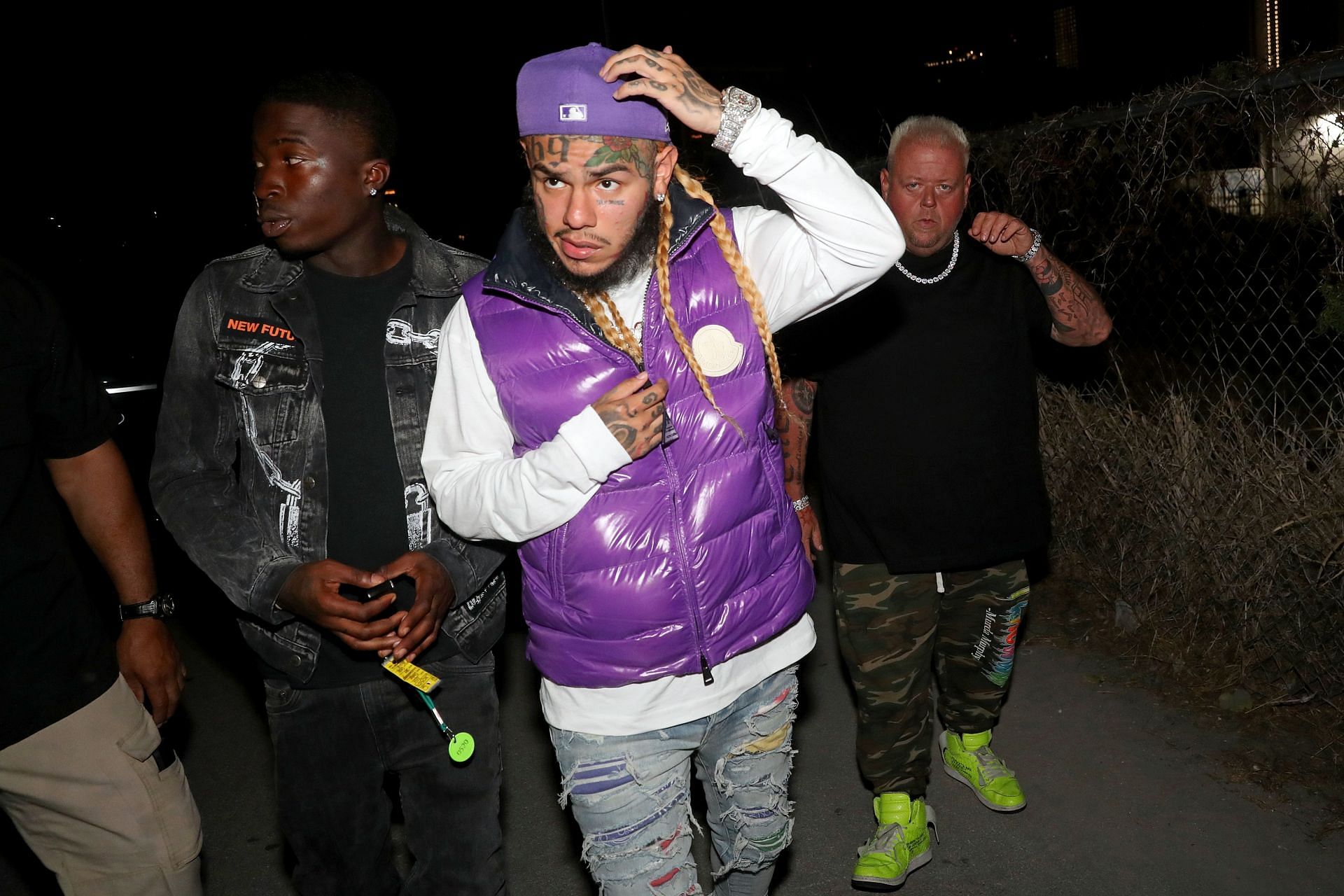 Rapper 6ix9ine has had multiple run-ins with the law (Image via Johnny Nunez/Getty Images)