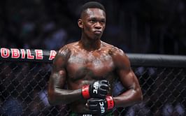 Israel Adesanya hits back with proof after fan asks why he dates "only white girls"