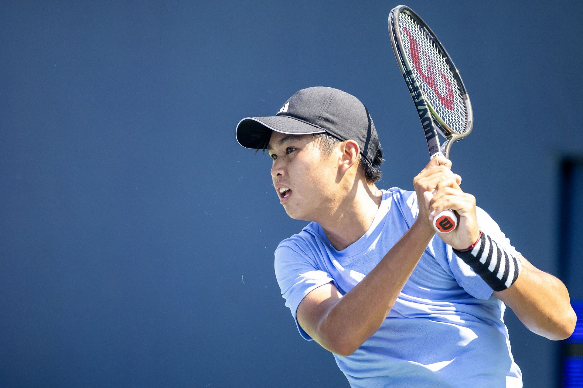 Tien plays a backhand in the US Open - Source: Getty