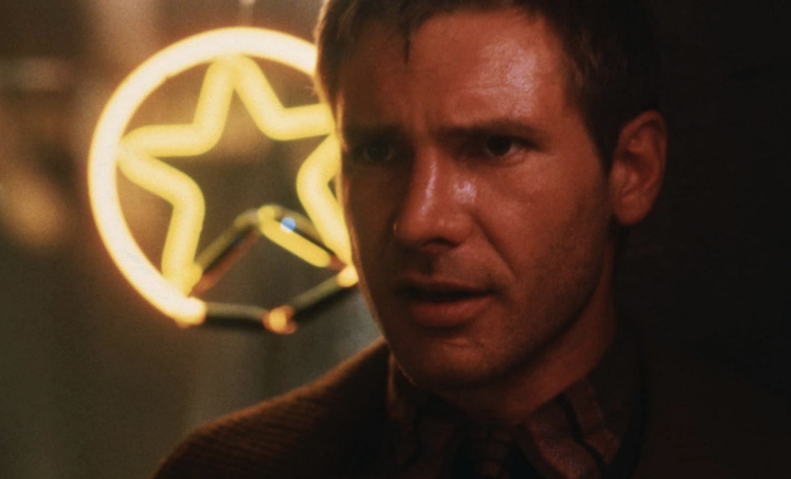 Harrison Ford in Blade Runner (Image via Warner Bros., The Ladd Company)