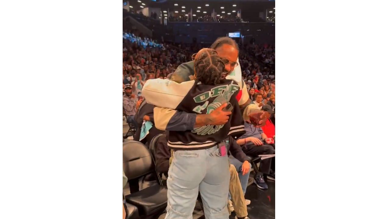 Carmelo Anthony and Alicia Keys sharing a hug during a timeout in Game 2 of the Liberty-Aces showdown [Photo: @WNBA/X]