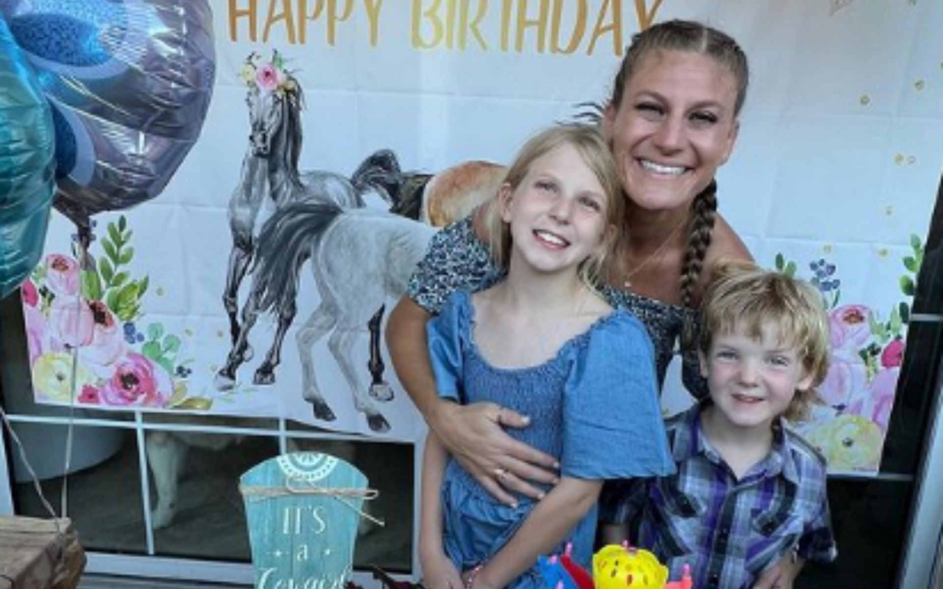 Kayla Harrison with her niece and nephew