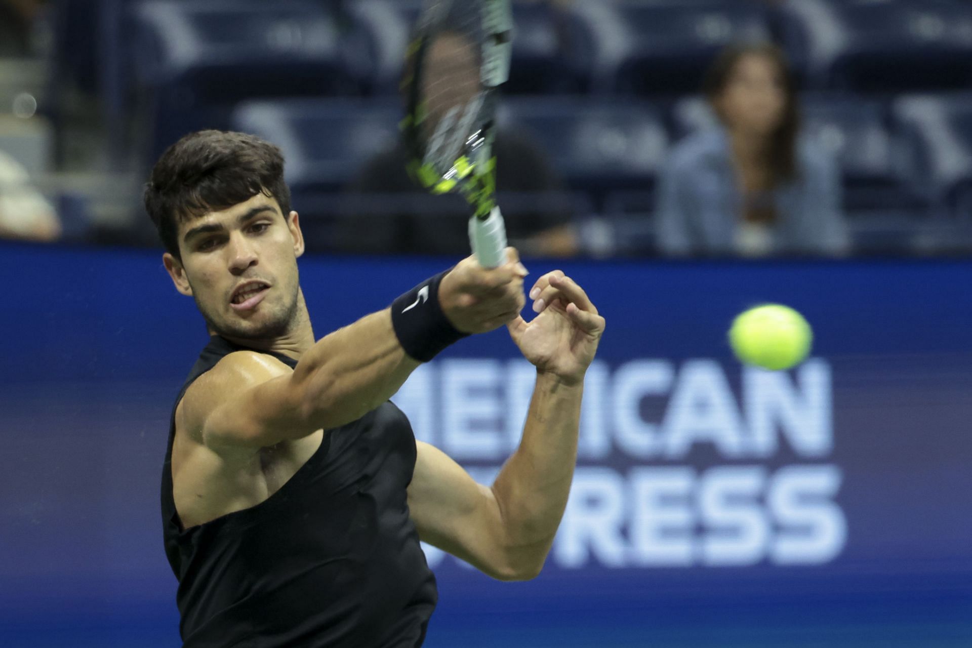 Carlos Alcaraz hits a forehand at US Open 2024