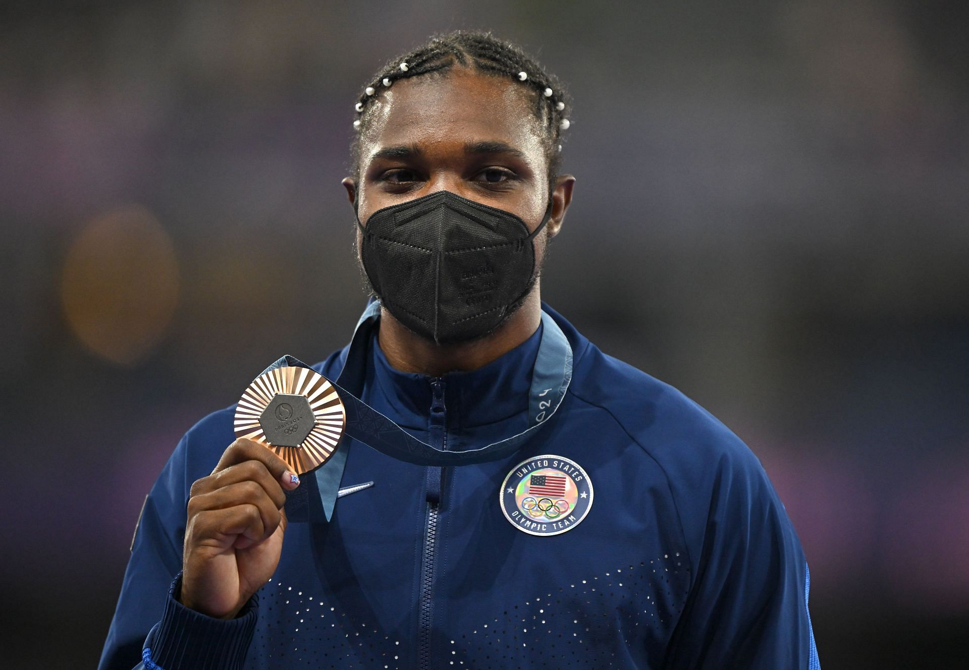 Noah Lyles of Team USA celebrates with his men&#039;s 200m bronze medal at the Stade de France during the 2024 Summer Olympic Games in Paris, France. (Photo via Getty Images)