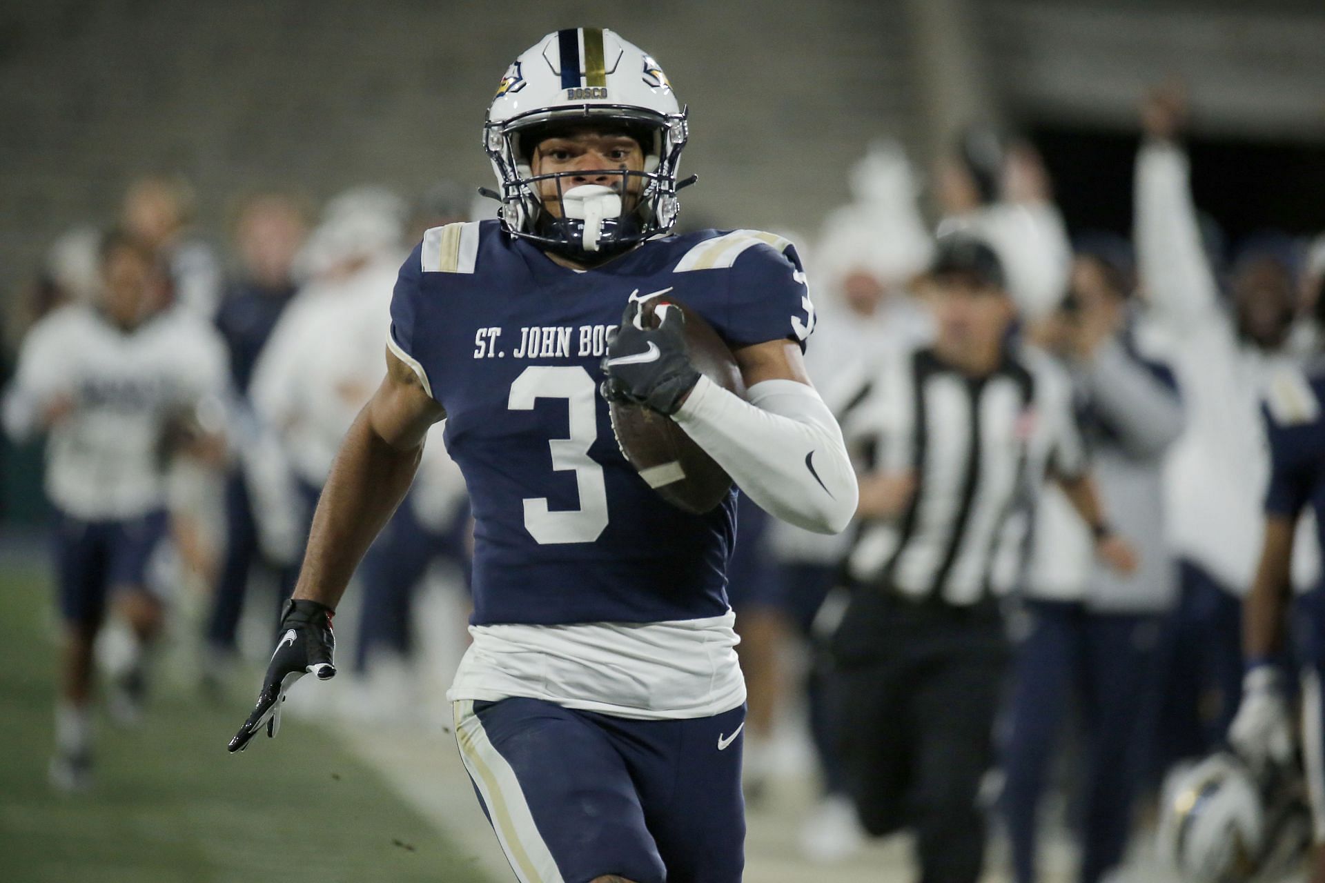 Action shots from CIF Southern Section Division 1 championship football game between Mater Dei High Schoiol and St. John Bosco High School at the Rose Bowl in Pasadena. Mater Dei coach Bruce Rollinson will coach his final game. Mater Dei quarterback Elija - Source: Getty