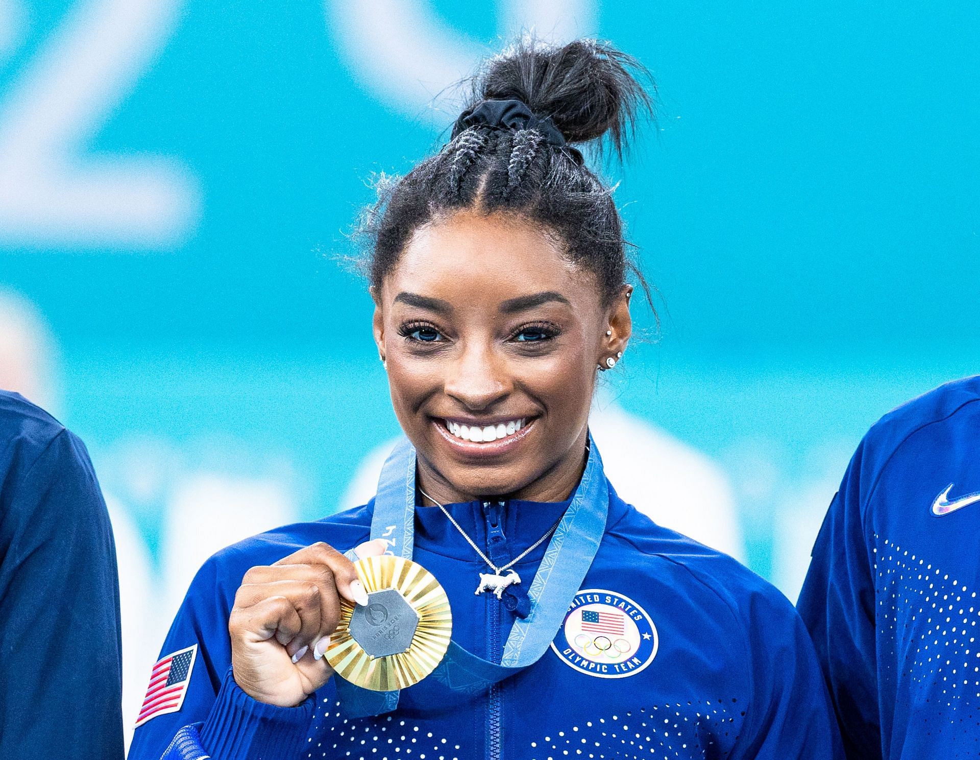 Simone Biles, who won the gold medal, poses on the podium at the artistic gymnastics women&#039;s all-around final of the 2024 Olympic Games at the Bercy Arena in Paris, France. (Photo via Getty Images)