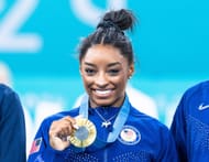 Simone Biles, who won the gold medal, poses on the podium at the artistic gymnastics women's all-around final of the 2024 Olympic Games at the Bercy Arena in Paris, France. (Photo via Getty Images)
