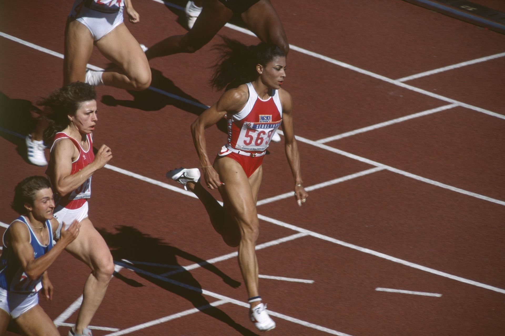 Florence Griffith Joyner competes in the women&#039;s 200-meter semi-final at the 1988 Olympics. (Photo via Getty Images)