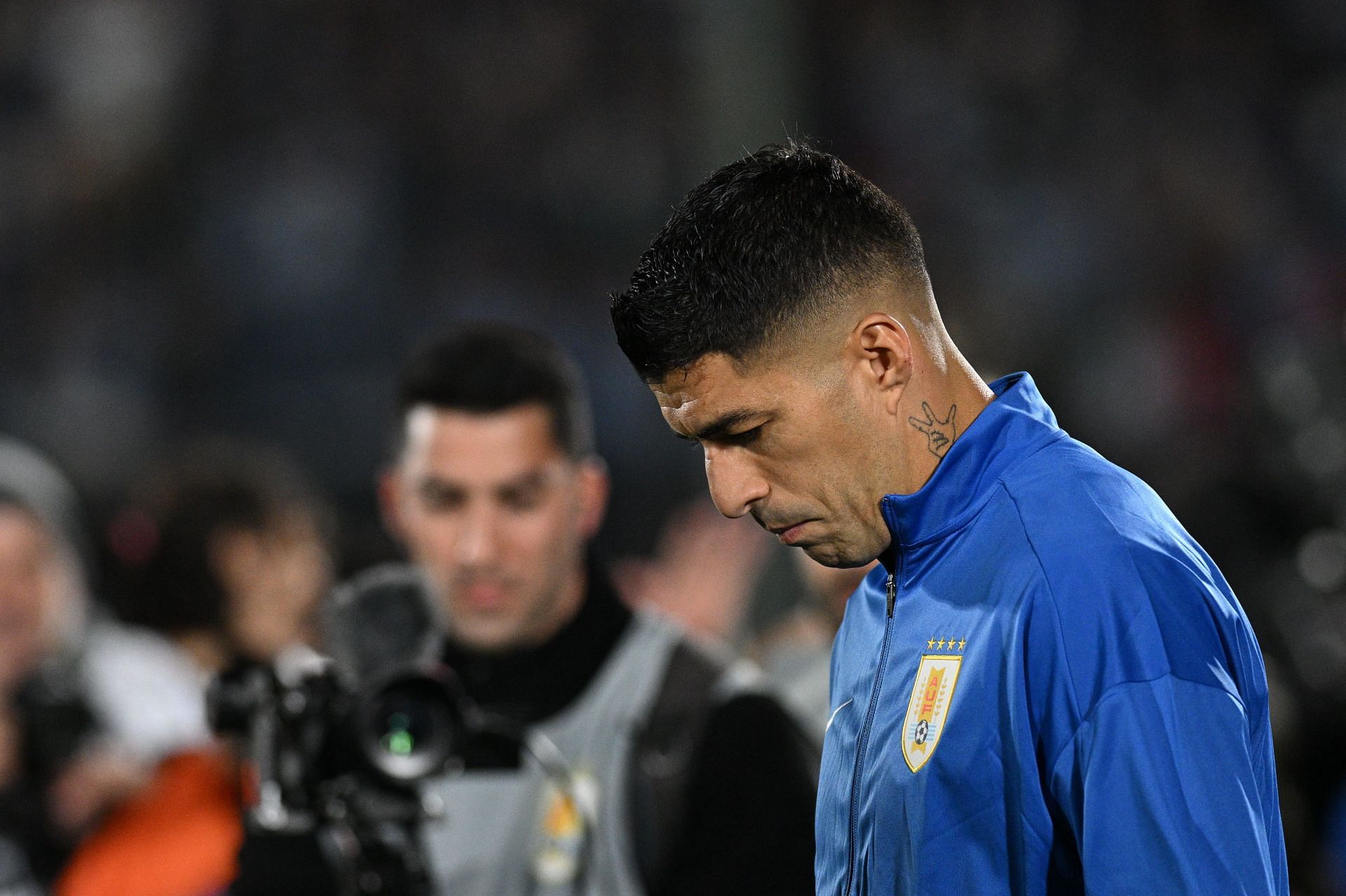 Uruguayan footballer Luis Suarez receives a tribute after playing his last match with his country