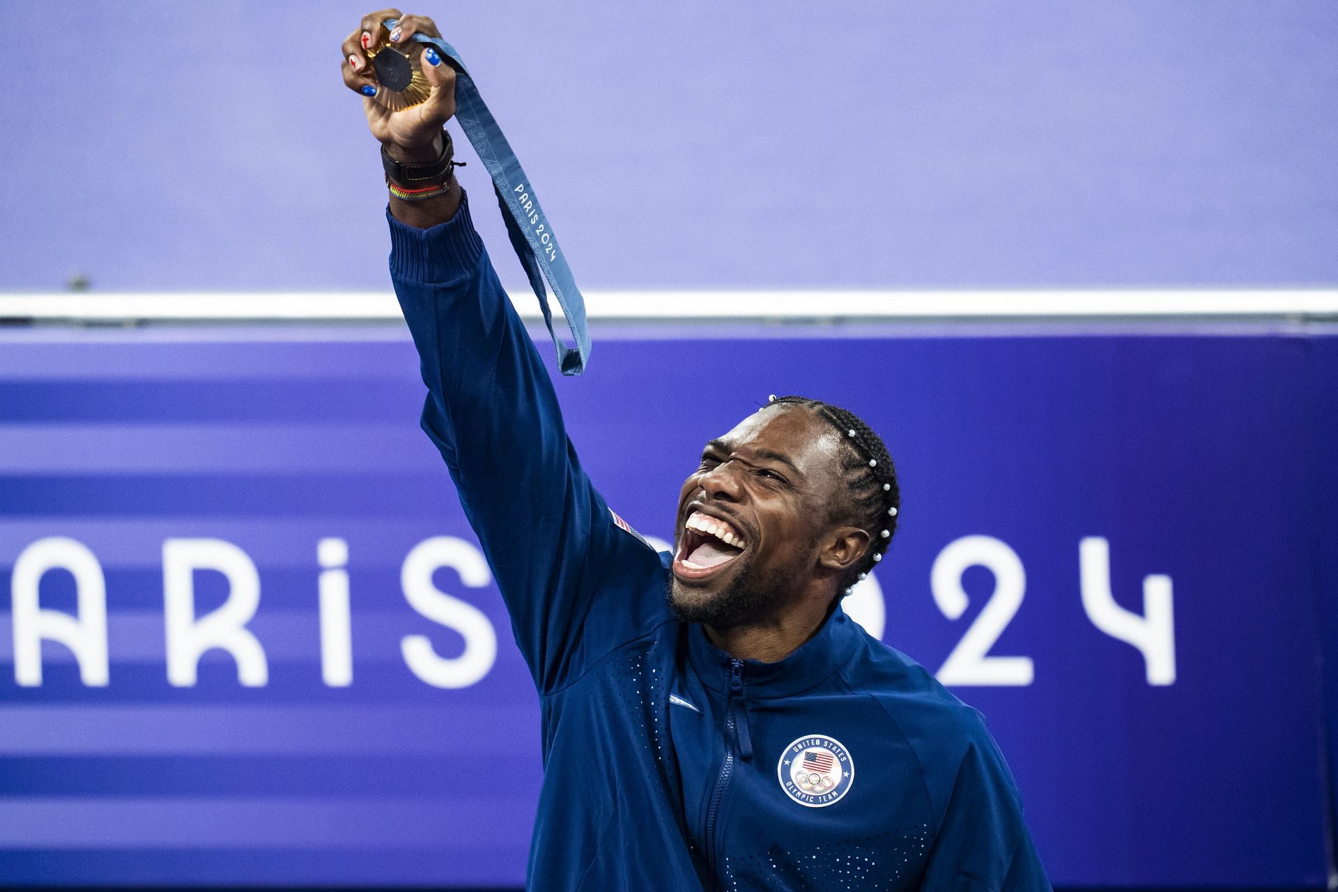 Gold medalist Noah Lyles, of the United States celebrates on the podium during a ceremony for the men&#039;s 100-meter final at the 2024 Summer Olympics in Saint-Denis in Paris, France. (Photo via Getty Images)