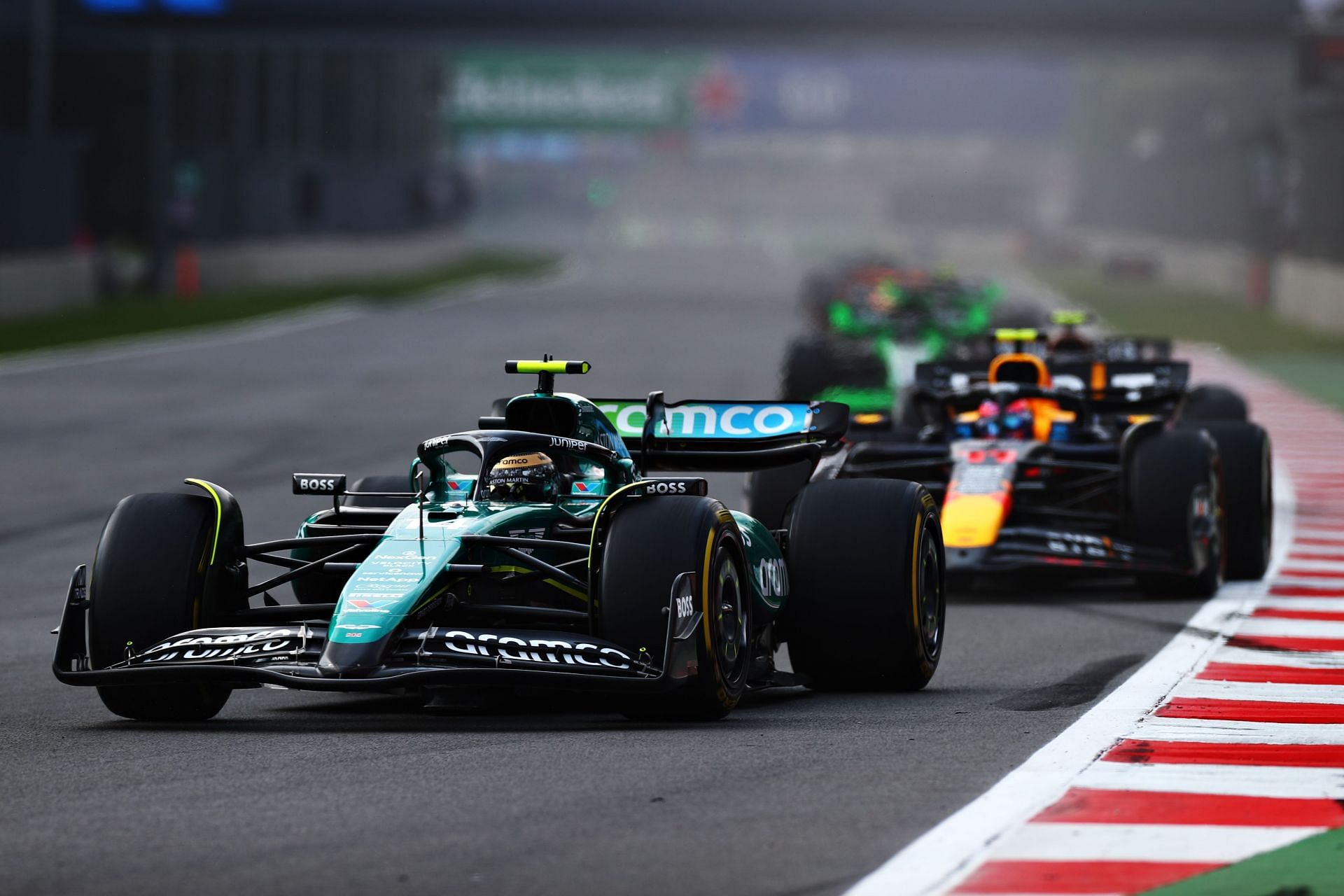 Fernando Alonso of Spain driving the Aston Martin AMR24 Mercedes leads Sergio Perez of Mexico at the F1 Grand Prix of Mexico - Source: Getty Images