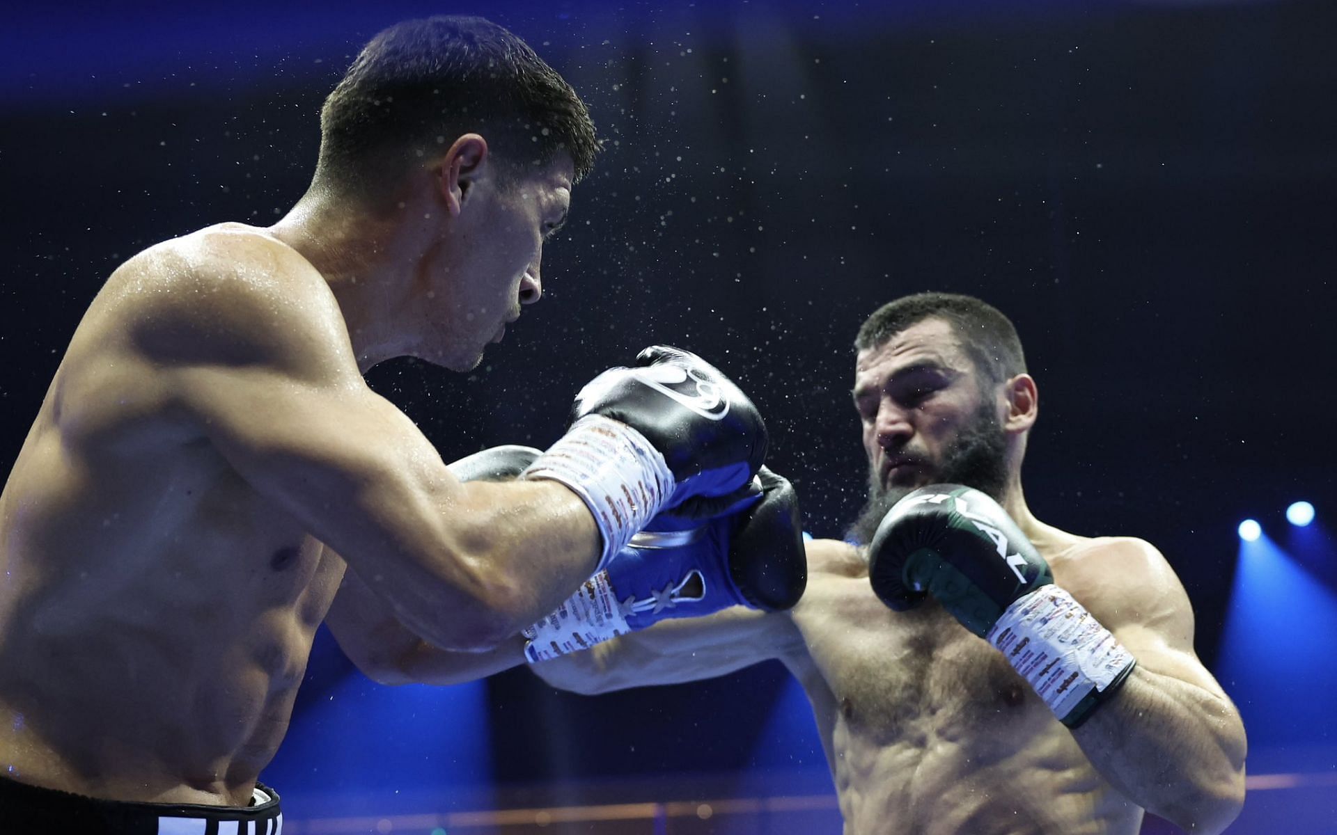 Dmitry Bivol (left) suffered his first professional boxing loss agaisnt Artur Beterbiev (right). [Image courtesy: @Queensberry on X]