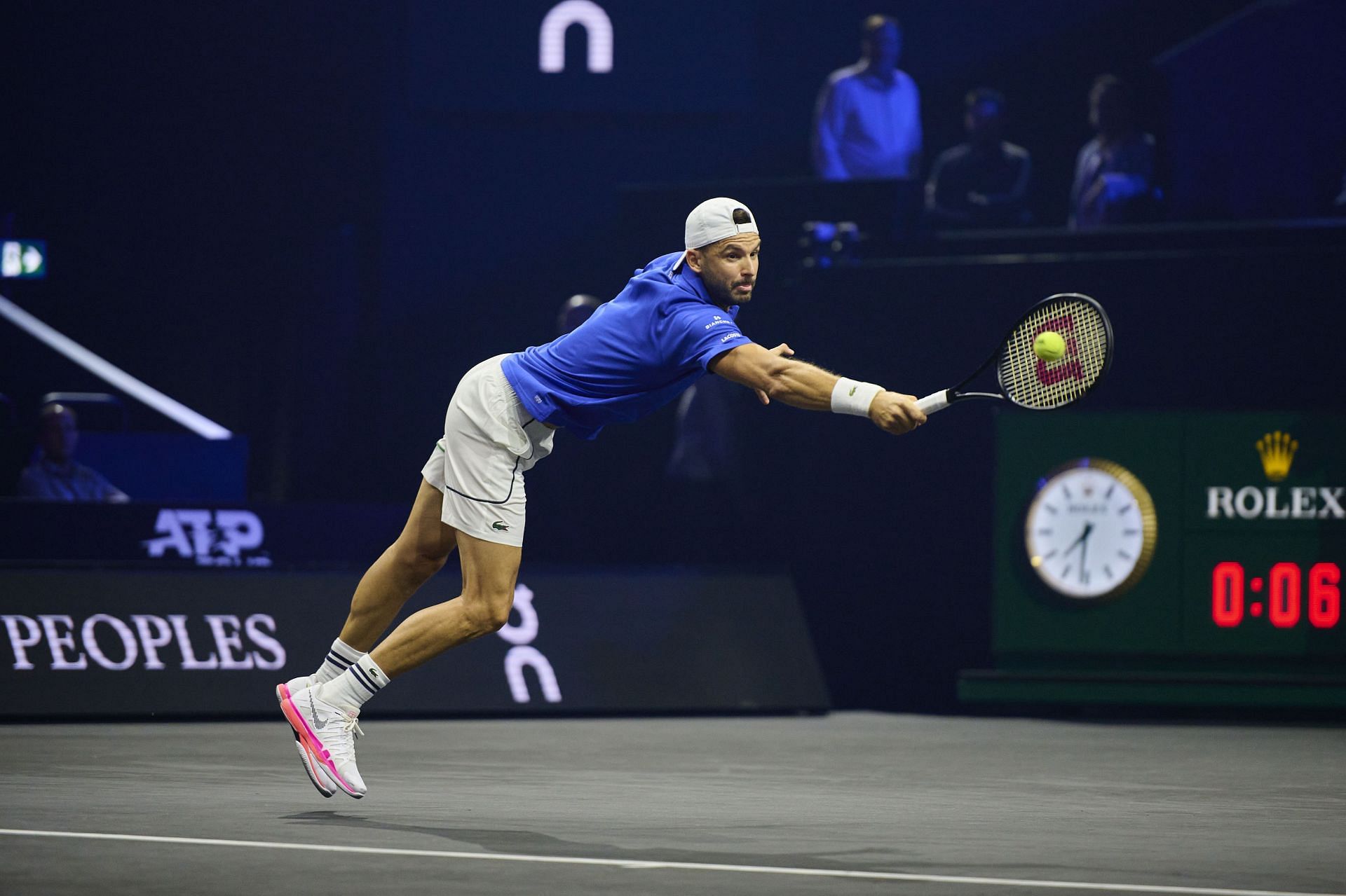 Dimitrov reaches for the ball (Getty)