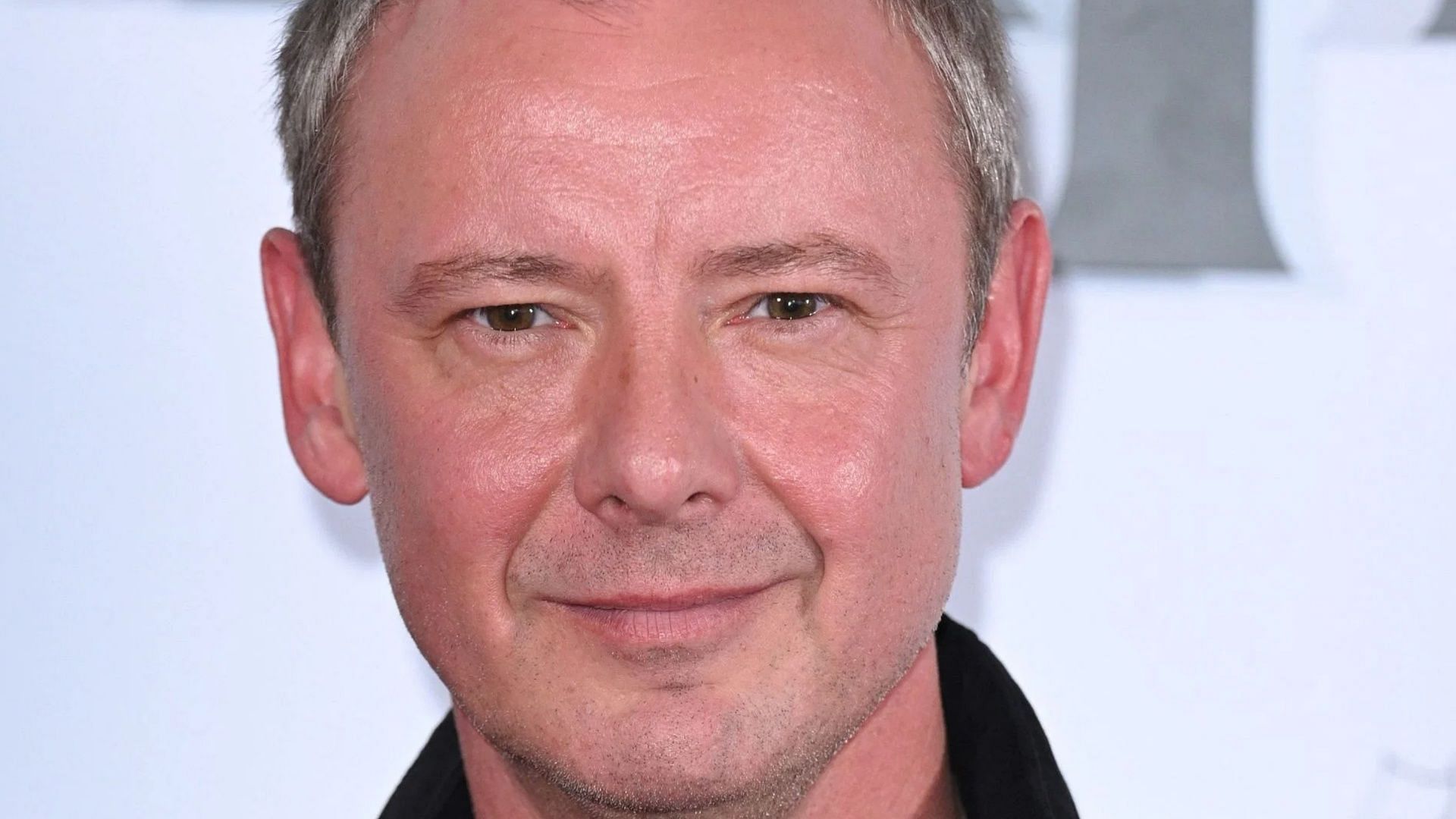 John Simm discovered that his dad was not his biological father (Image via Getty)