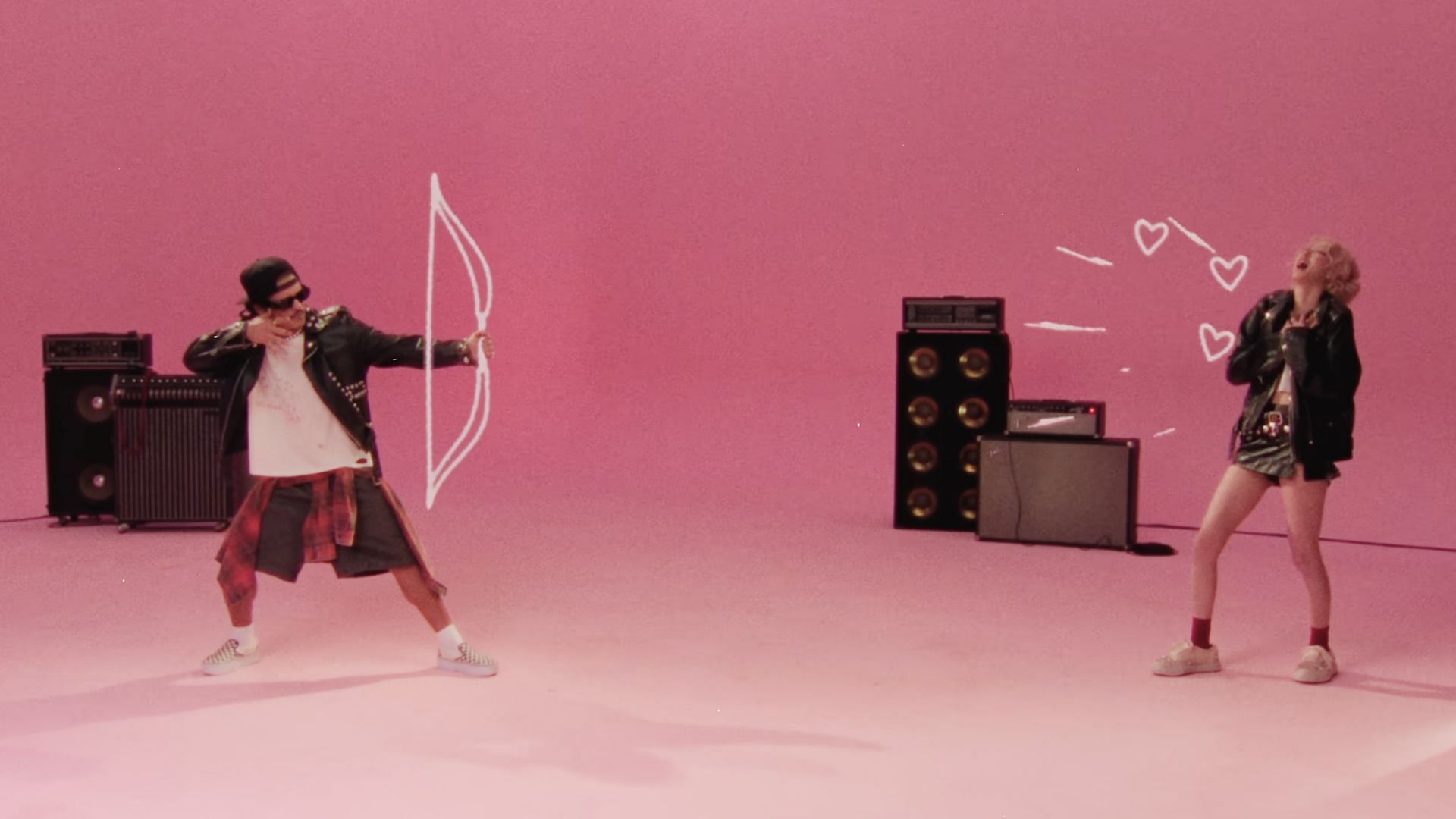 A screenshot from the official music video for Rośe and Bruno Mars