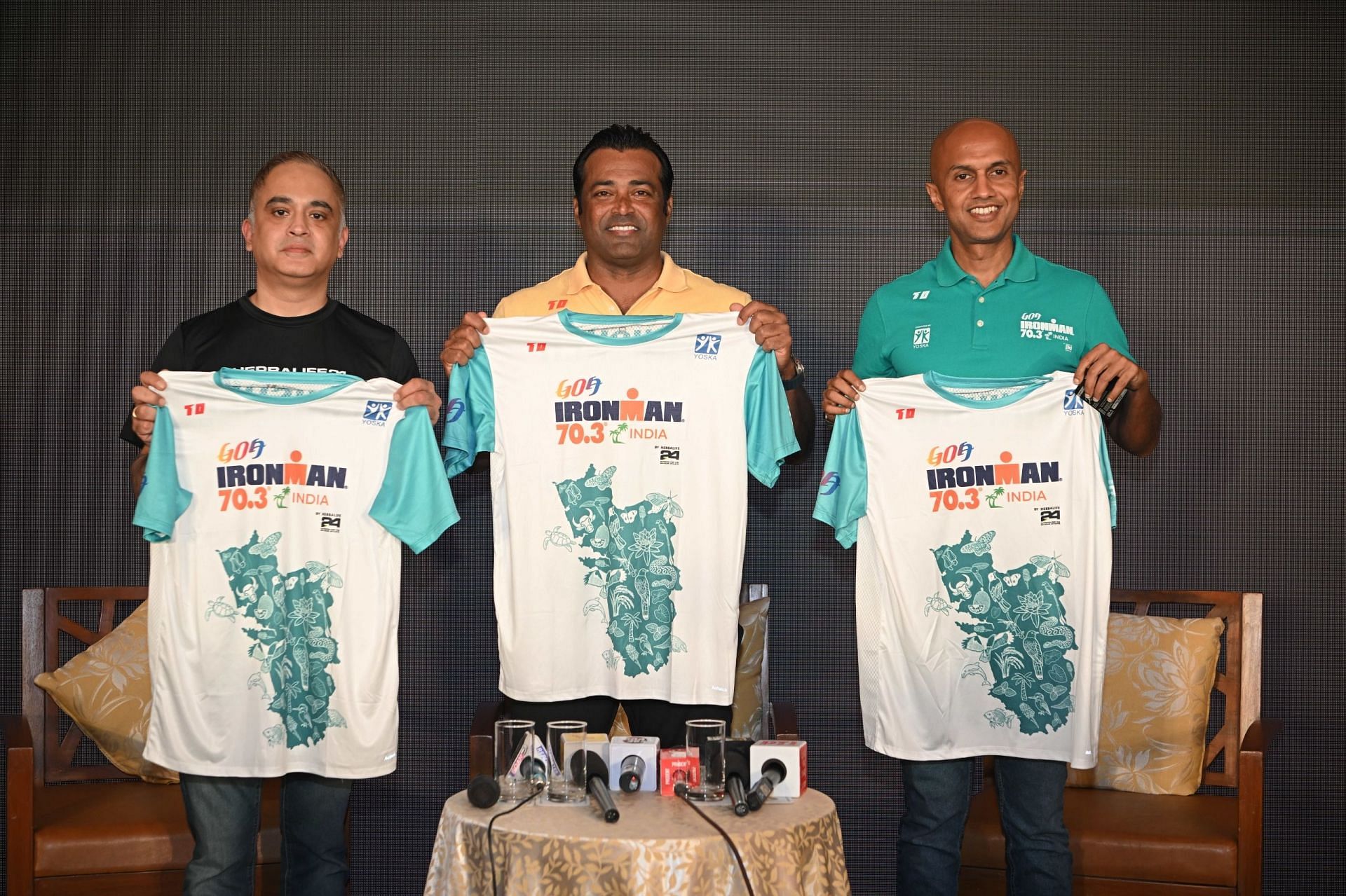 Race Ambassador Leander Paes (centre), Race Director Deepak Raj (right) &amp; Ganeshan V S, director of marketing at Herbalife India (left) unveil the jersey that participants will be donning. 