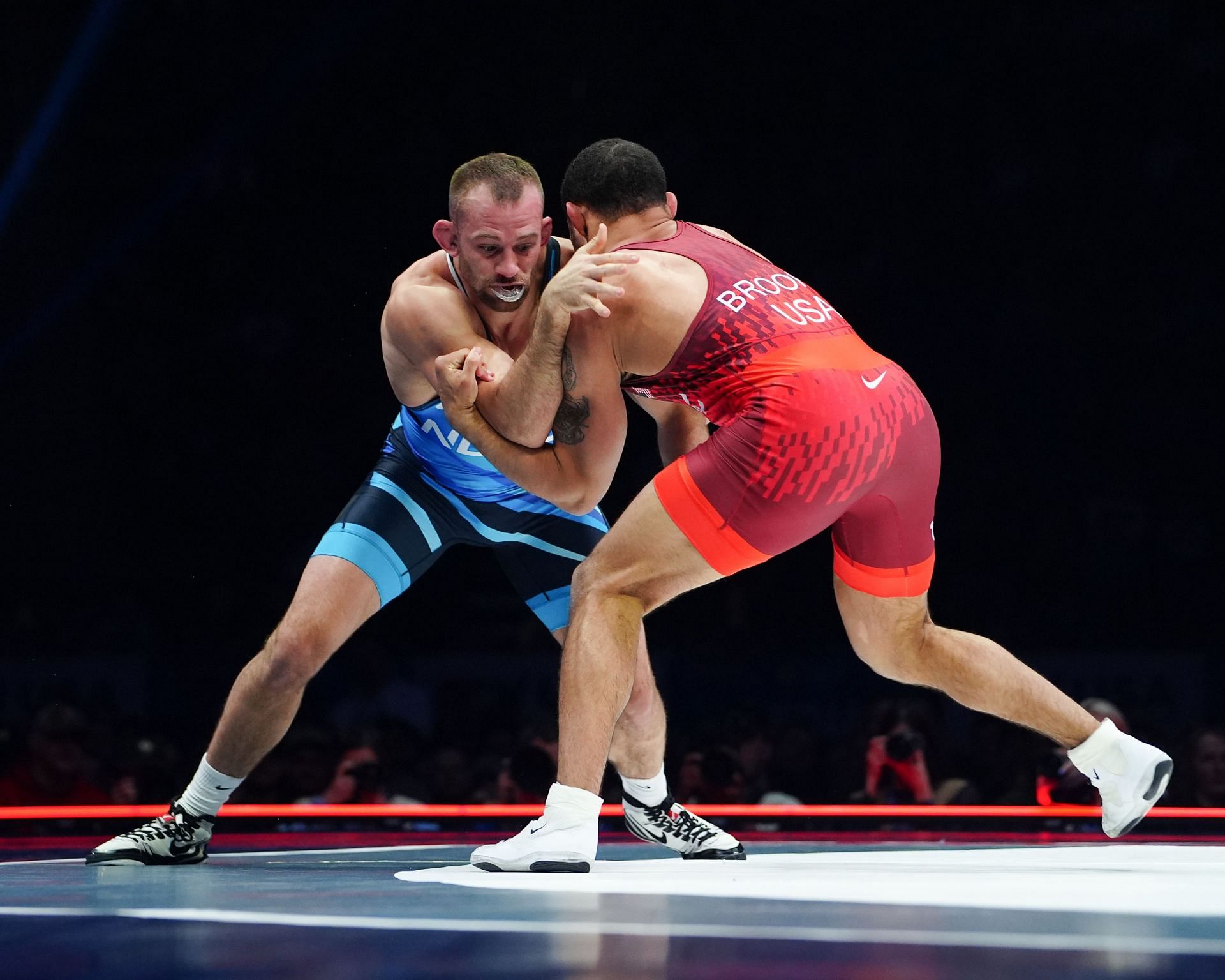 David Taylor (blue) in action against Aaron Brooks at US Olympic Wrestling Team Trials. (Photo via Getty Images)