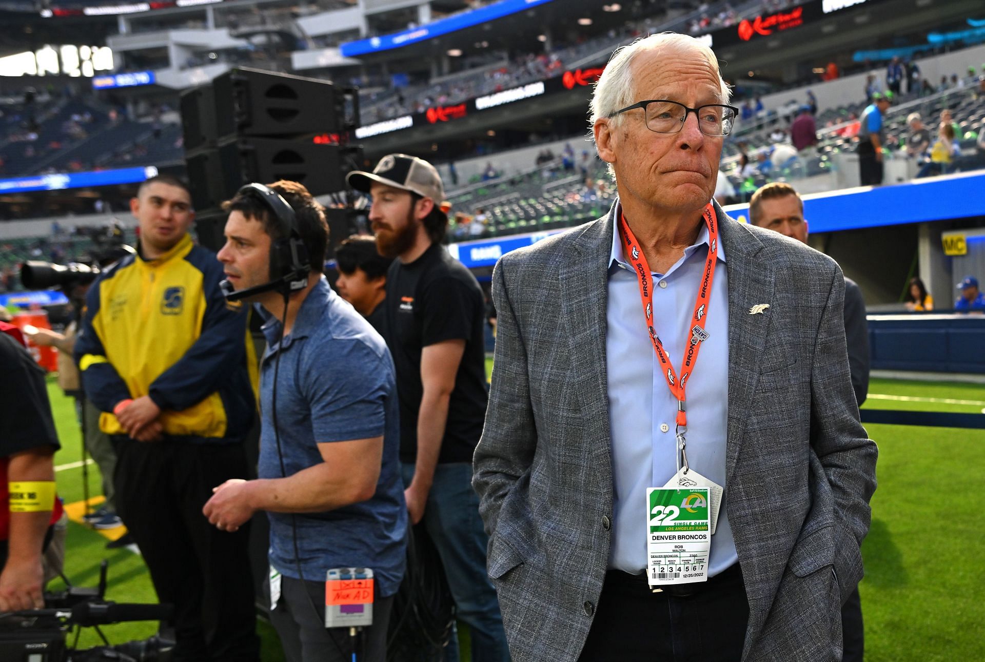 Rob Walton, owner of the Denver Broncos, on the field before a game - Source: Getty