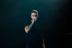 Liam Payne's fans fight with paparazzi to protect singer's father Geoff Payne's privacy as he visits hotel where his son died