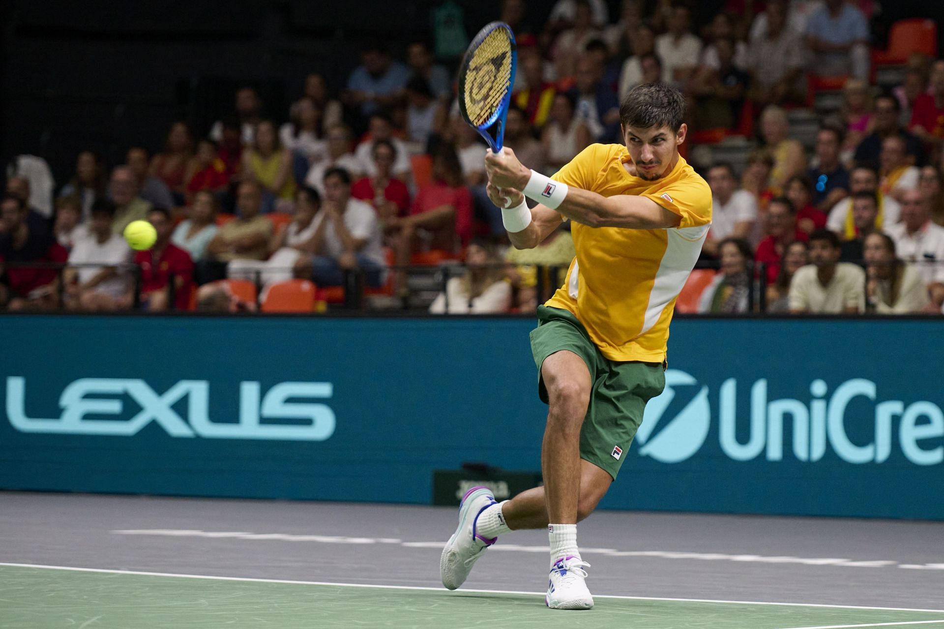 Popyrin plays a backhand in the 2024 Davis Cup Finals Group - Source: Getty