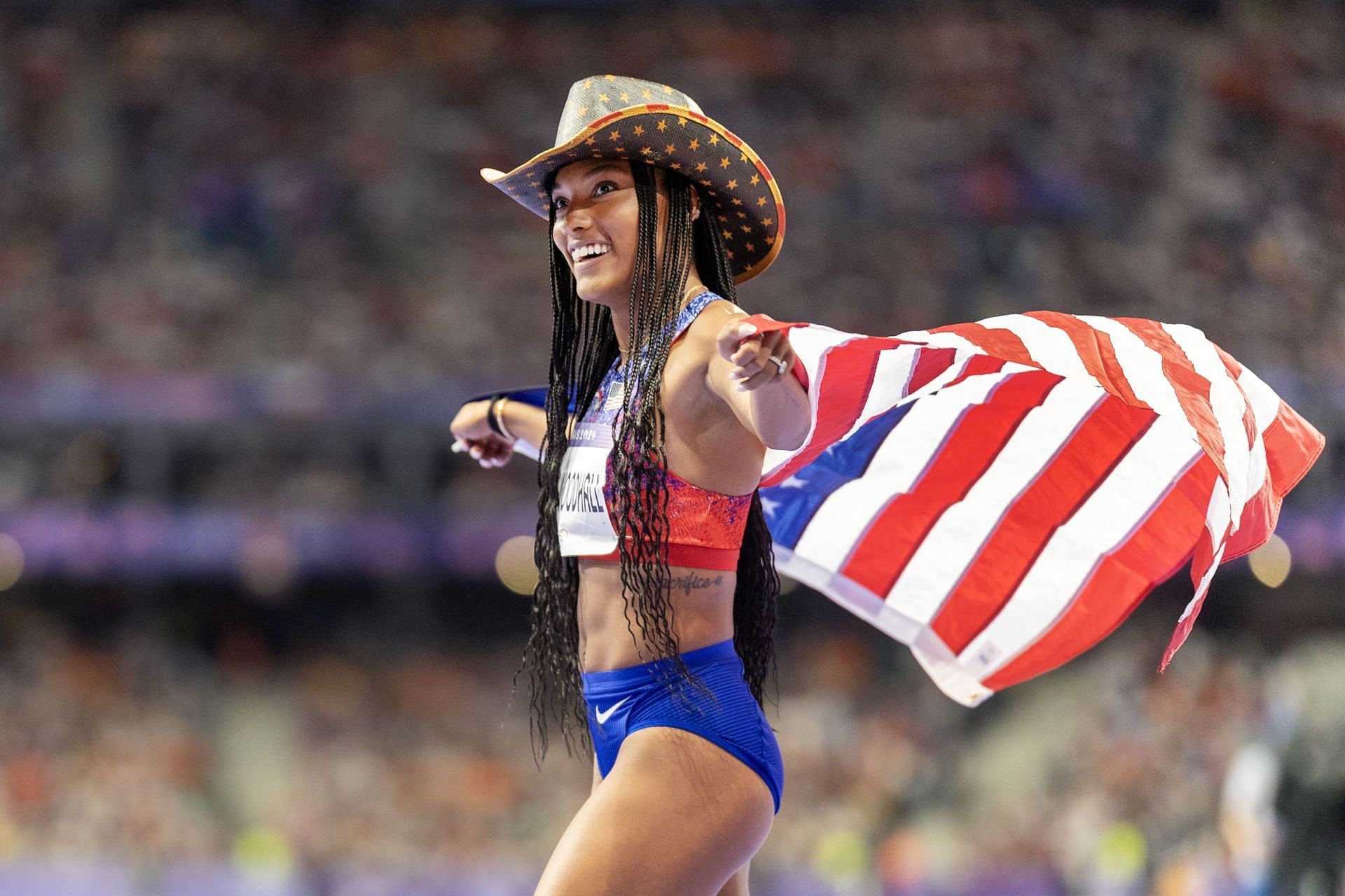 Tara Davis-Woodhall celebrates her victory at the Paris Olympics [Image Source: Getty]