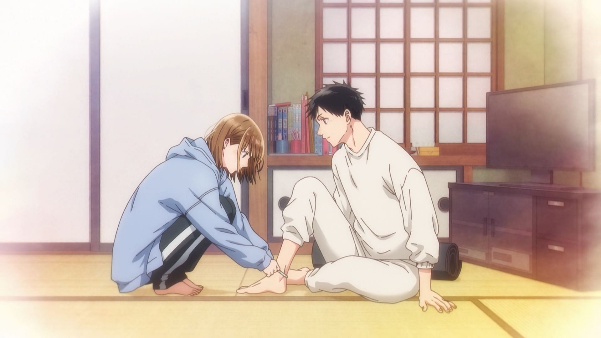 Chinatsu puts the good luck bracelet on Taiki&#039;s ankle (Image via Telecom Animation Film)