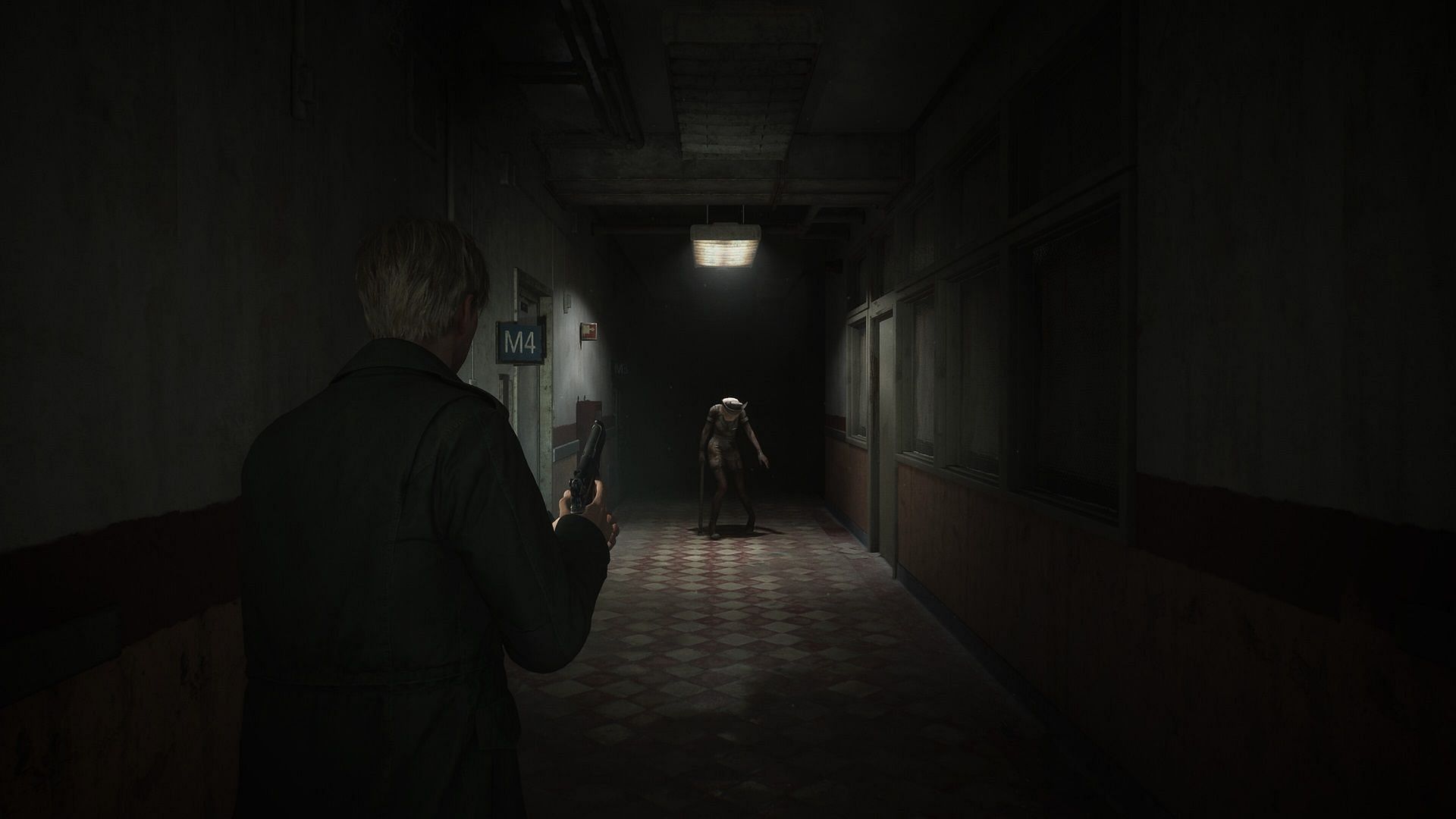 Protagonist in Silent Hill 2 aiming with their pistol at a enemy