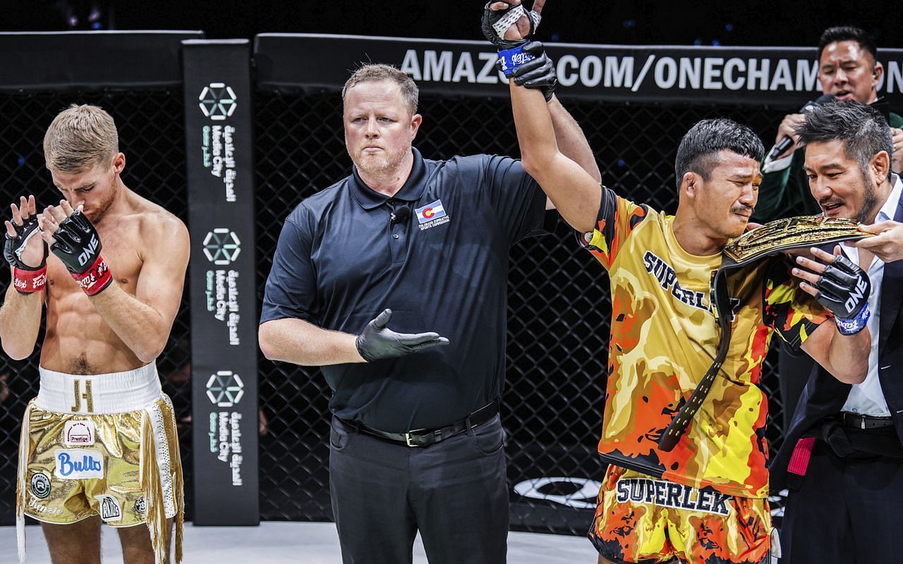 Superlek Kiatmoo9 (right) receives the ONE bantamweight Muay Thai world title from ONE Championship CEO Chatri Sityodtong at ONE 168. [Photo from ONE Championship]