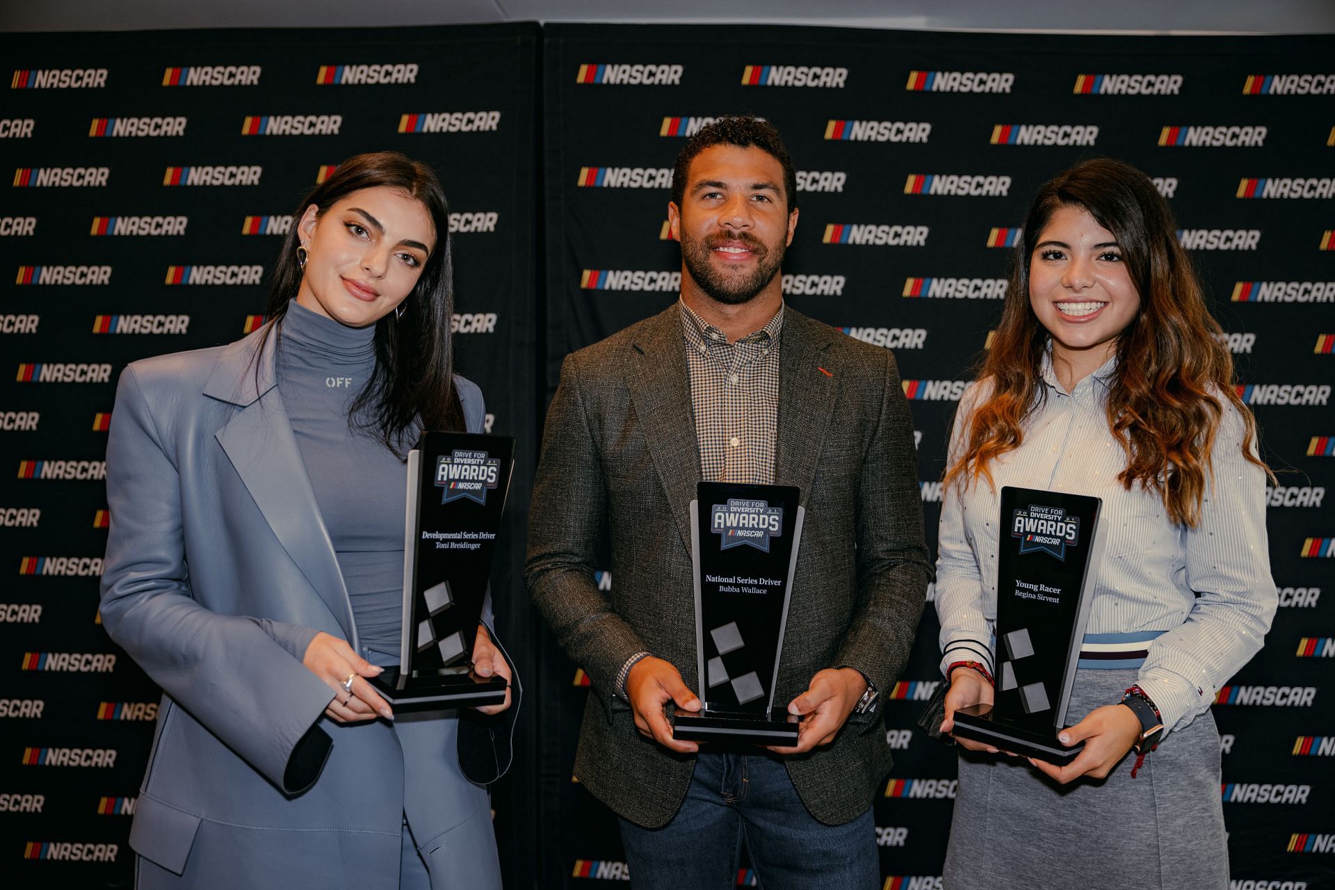 Toni Breidinger, Bubba Wallace, and Regina Servant at NASCAR&#039;s Drive for Diversity Award ceremony at the NASCAR Hall of Fame on October 7, 2021, in Charlotte, North Carolina. (Source: Getty)