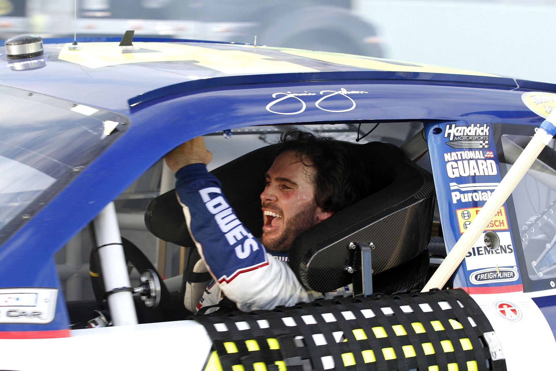 Jimmie Johnson after winning the 2010 Sprint Cup Championship at the Homestead-Miami Speedway (Source: Getty)