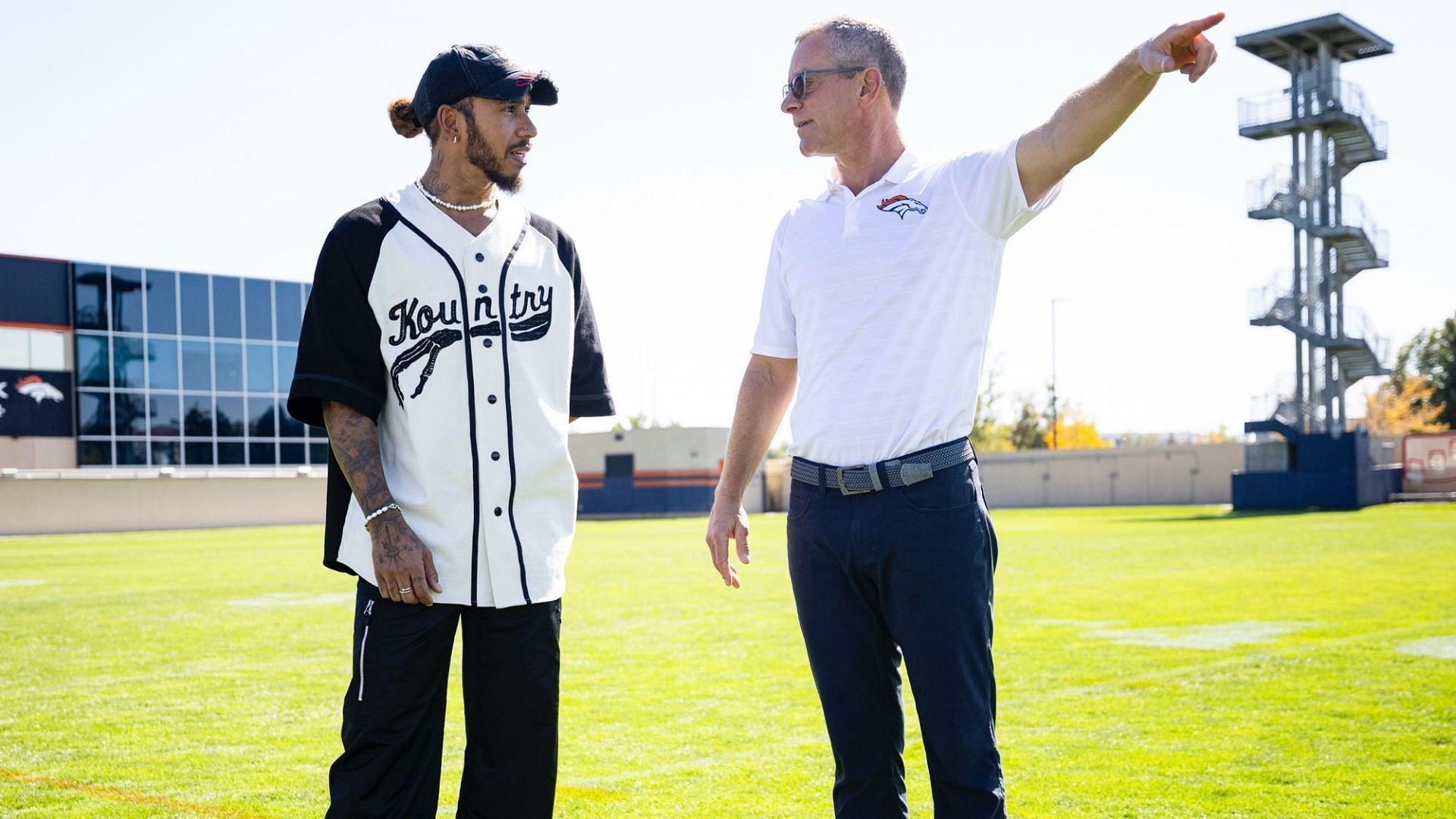 Lewis Hamilton with Greg Penner (@Broncos on X)