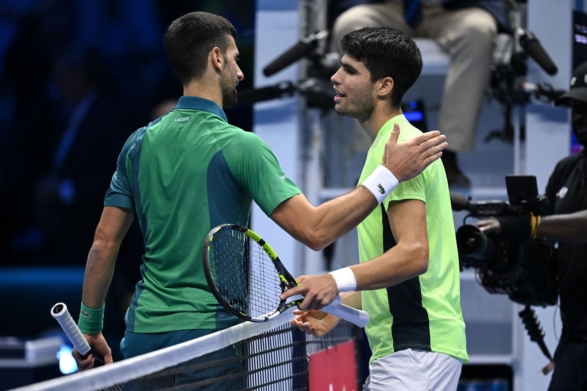 Novak Djokovic and Carlos Alcaraz greet each other at ATP Finals 2023