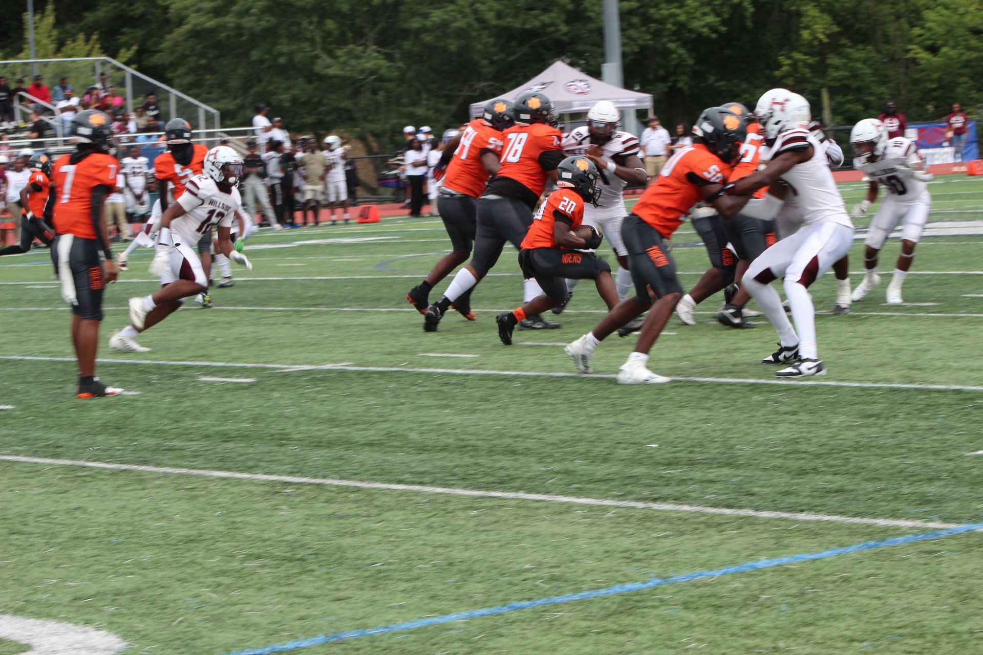 Hillside&#039;s  Darren Ikinnagbon (No. 11) sheds a blocker while Snyder (Jersey City) quarterback Shymeir Hargrove (No. 7) watches his running back tote the ball upfield for a short gain earlier this season.