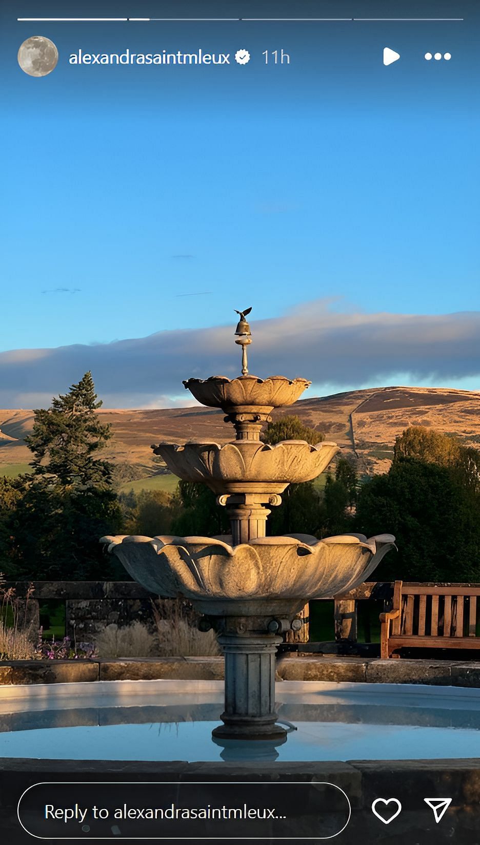 A vintage water fountain with a scenic backdrop (Source: @alexandrasaintmleux on Instagram)