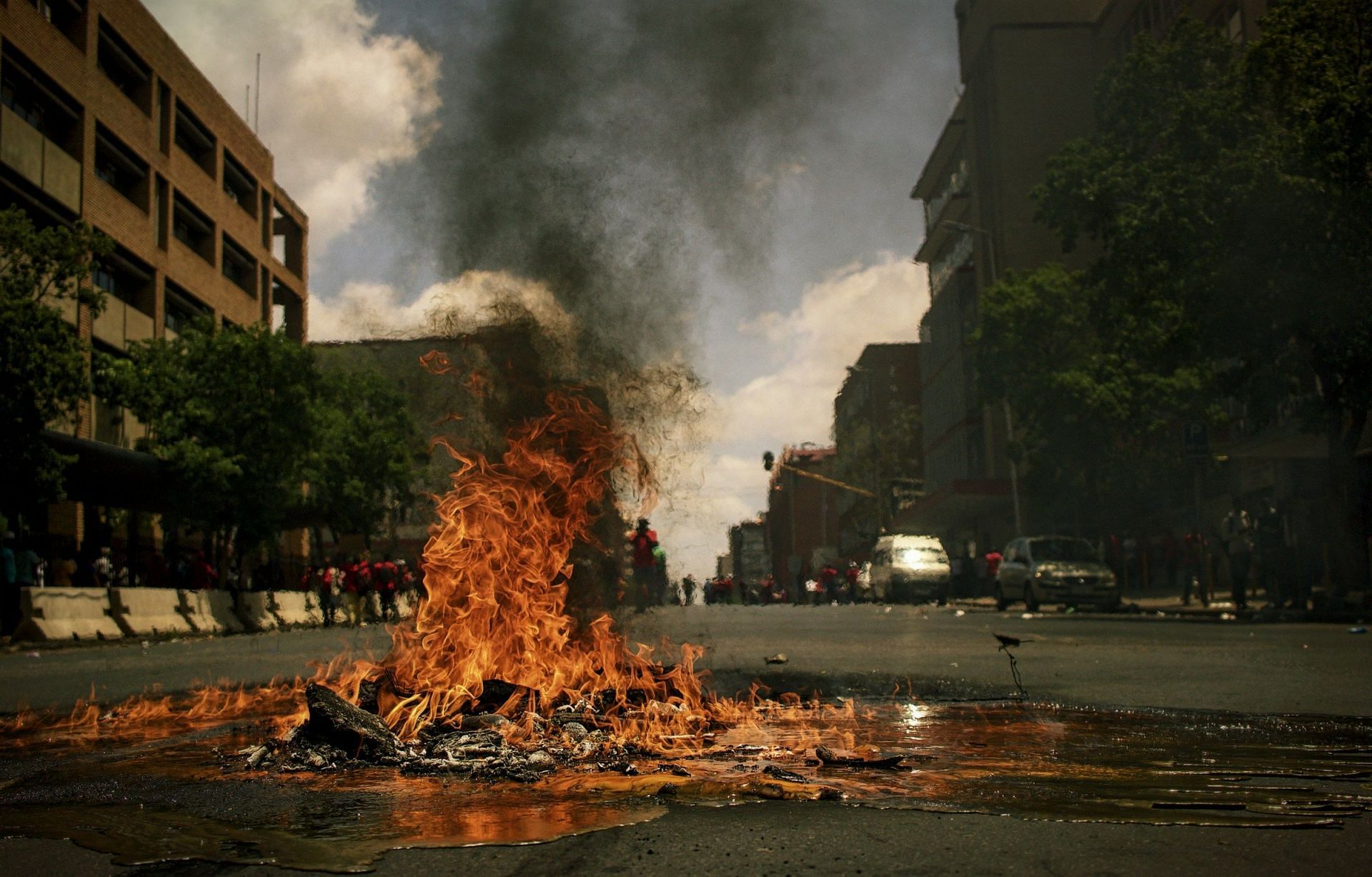 https://unsplash.com/photos/fire-burning-on-the-road-with-high-rise-buildings-during-daytime-photography-49LBMXrY5BE