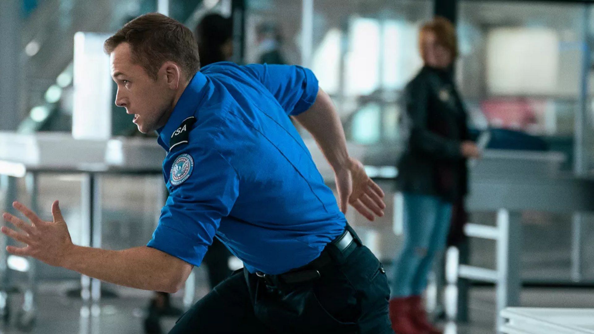 Taron Egerton is seen in a still from Carry-On (Image via Netflix)