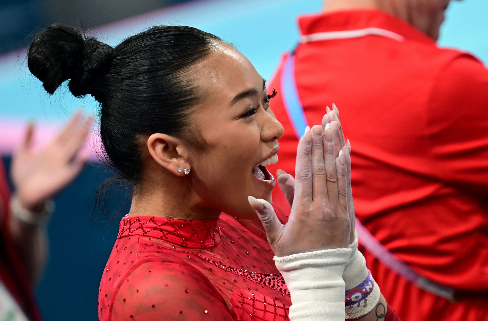 Suni Lee from the USA celebrates the bronze medal in the uneven bars at the 2024 Olympics in Paris, France. (Photo via Getty Images)