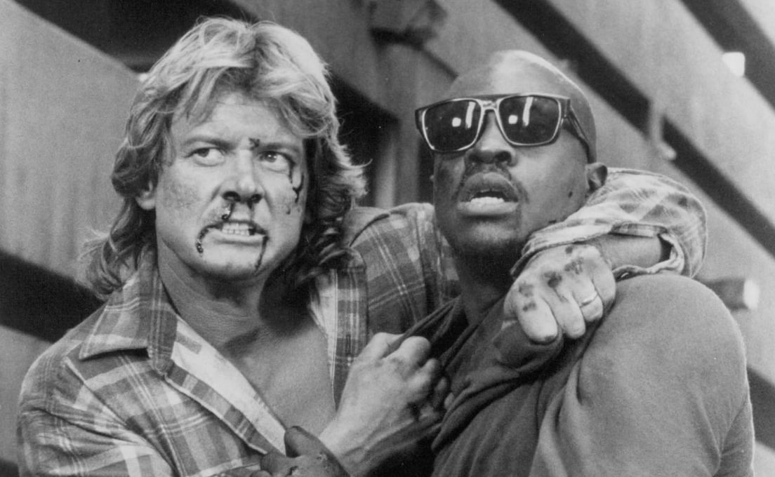 Keith David and Roddy Piper in They Live (Image via Universal Pictures)